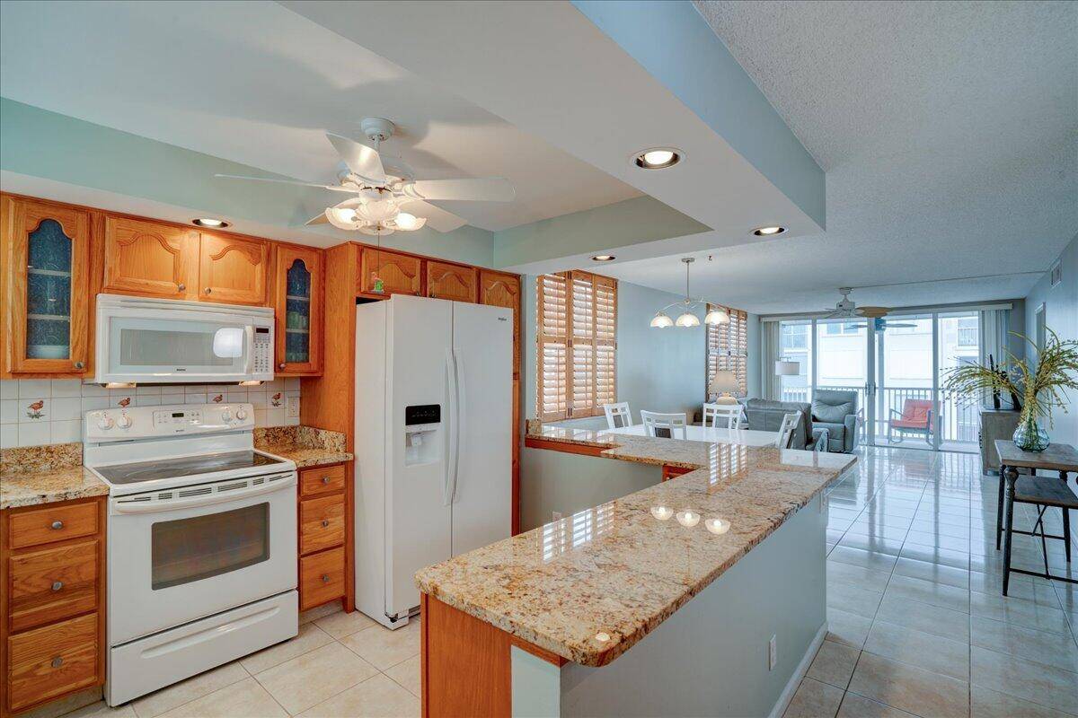 Experience the charm of this light filled, corner end unit, perfectly situated in a high demand location on the Intracoastal Waterway.