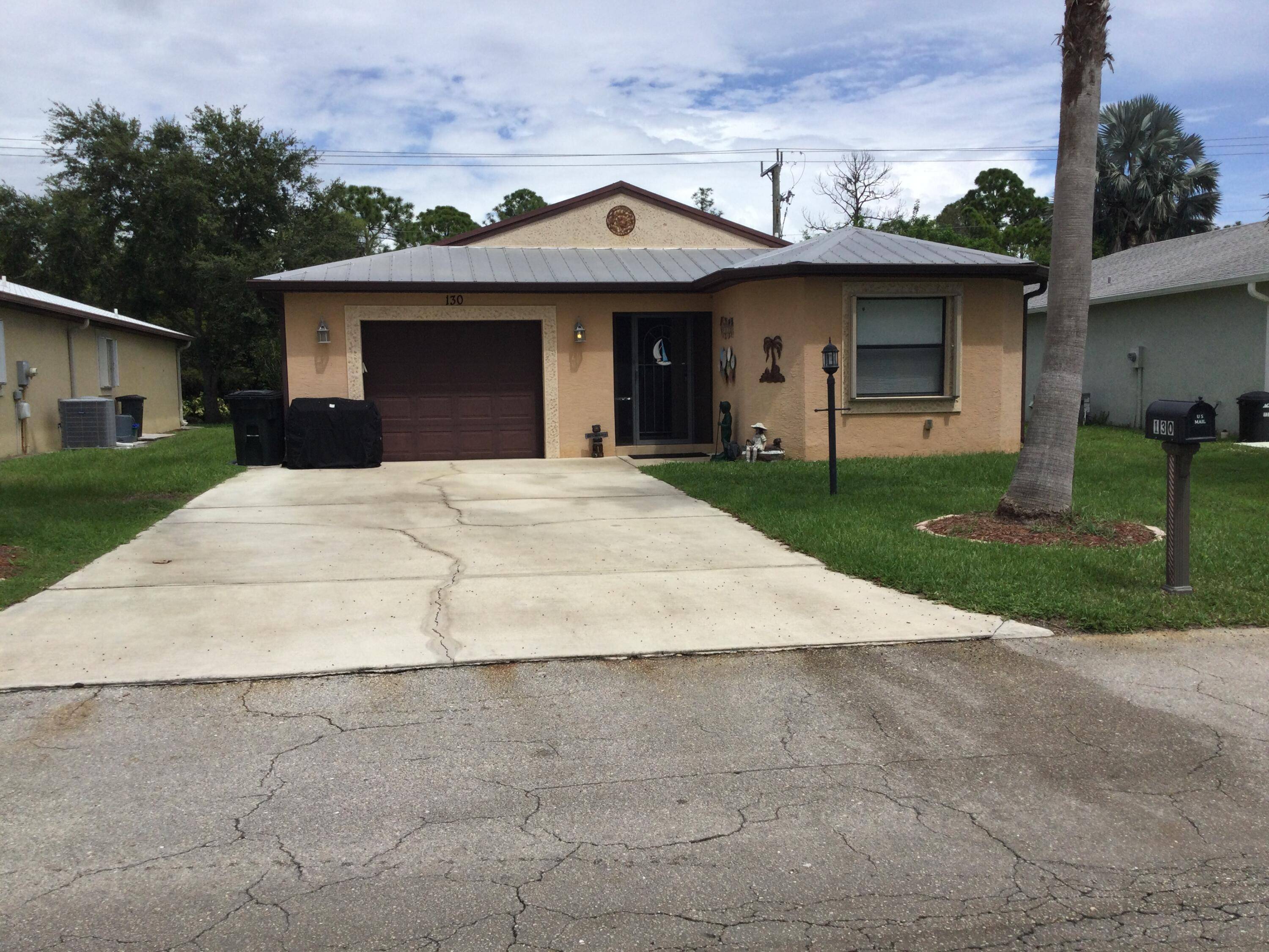 Nicely maintained concrete block home in the much sought after Spanish Lakes Community.
