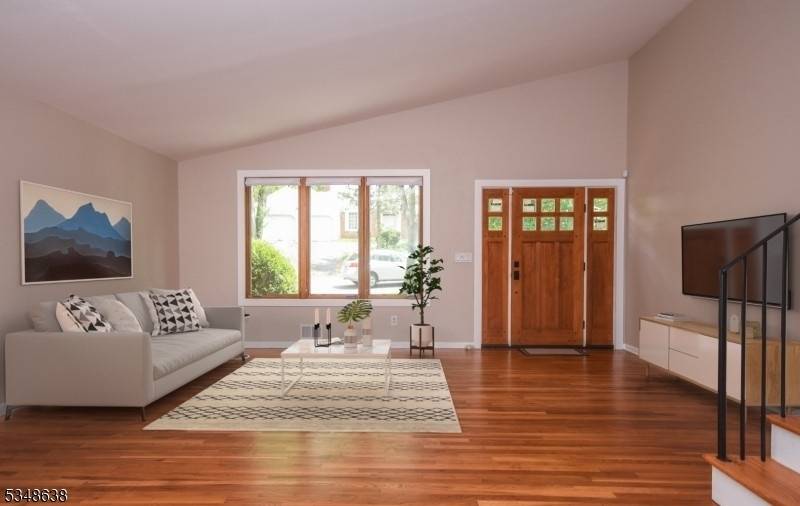 Fully renovated, light filled split level home in Montrose with soaring vaulted ceilings and an open, modern layout.