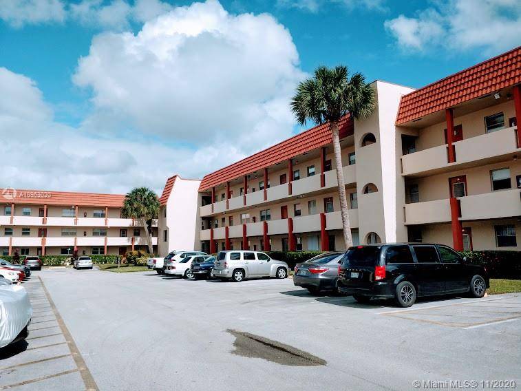 This is a modern and spacious corner unit at Sunrise Lakes Condominium Phase 1 with a beautiful view to the pool, club house and lake.