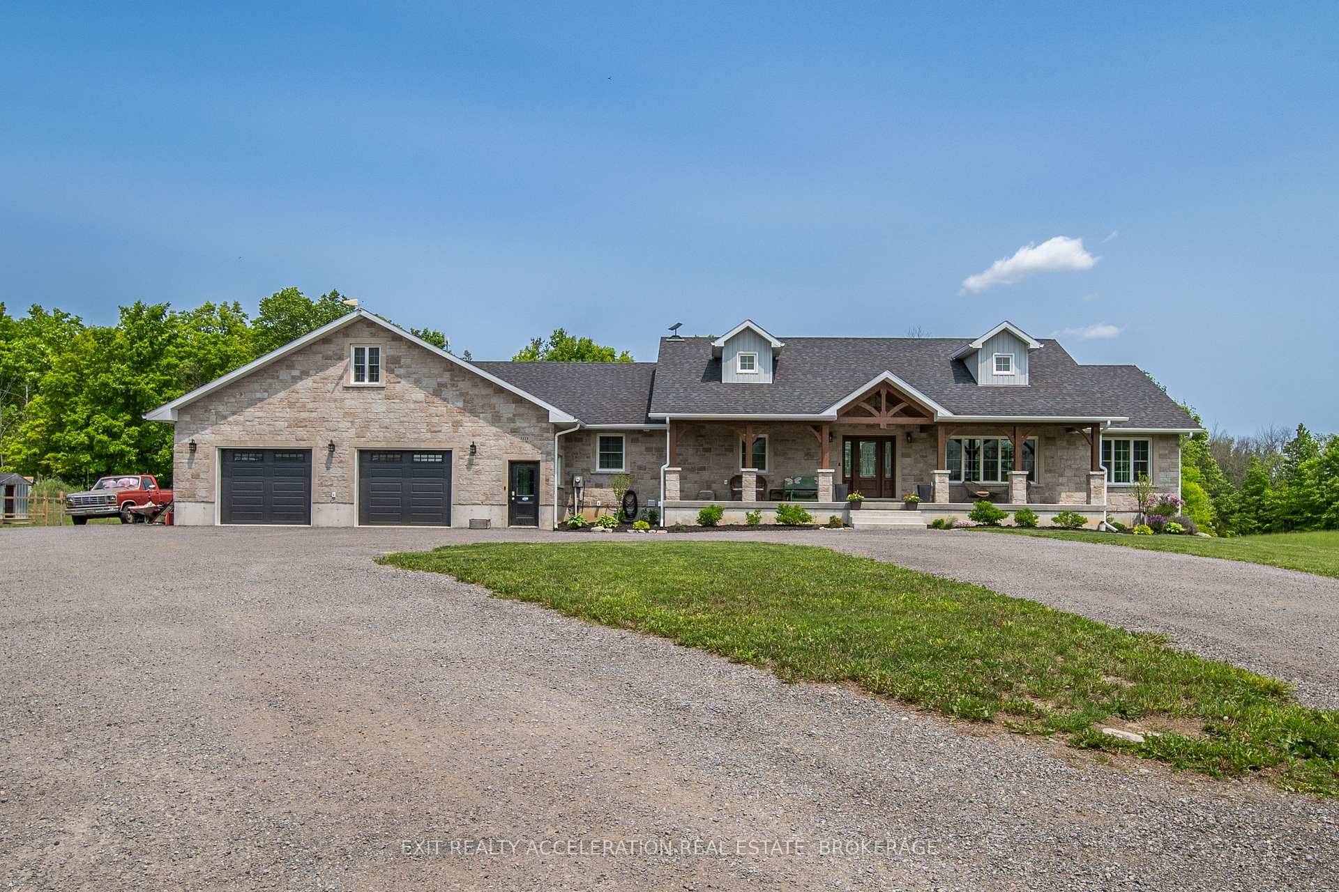 Situated on over 16 acres of serene countryside, this exquisite stone bungalow, built in 2022, offers a blend of modern luxury and rustic charm.