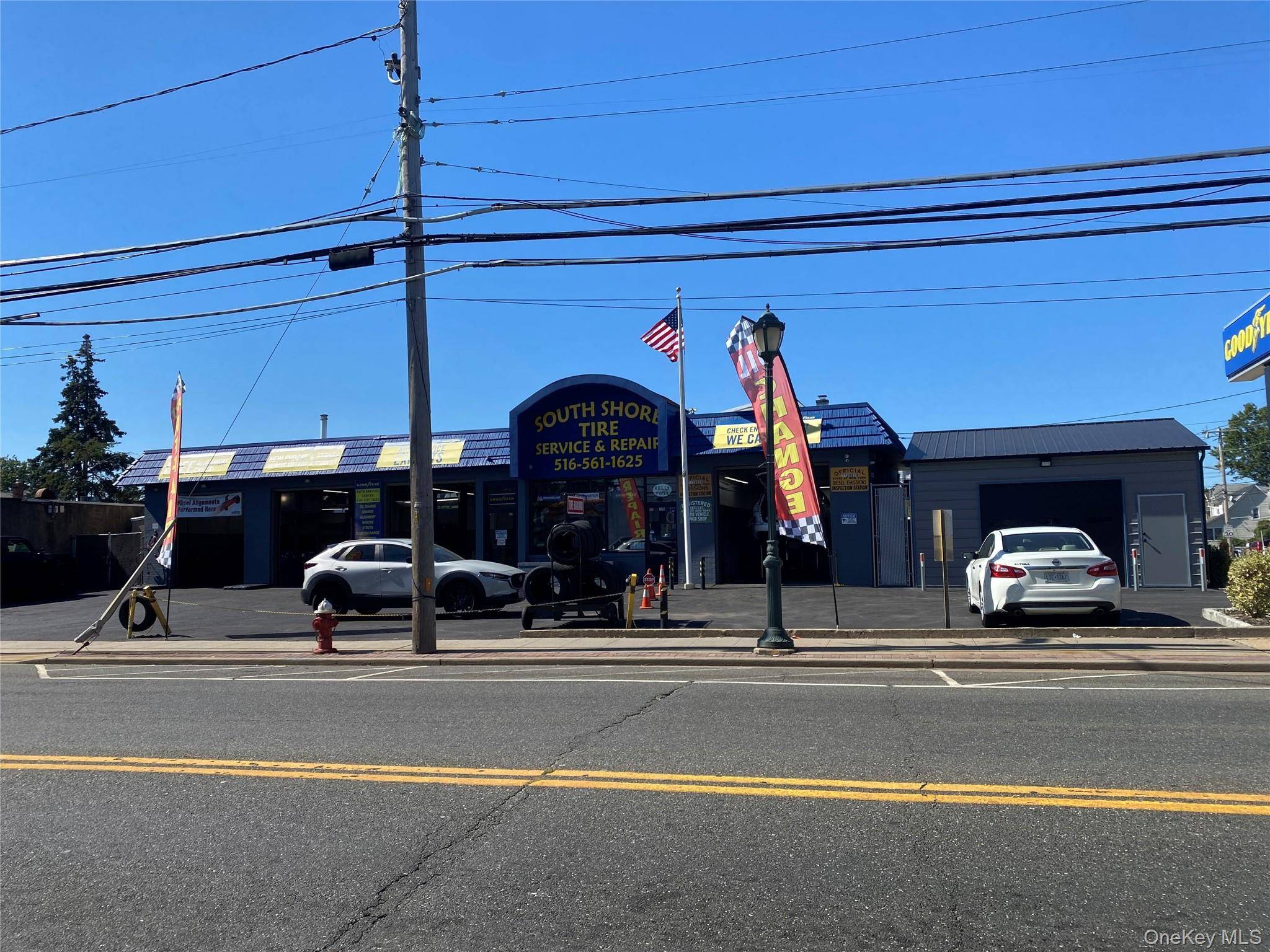 Fully renovated modern automotive repair building, with comfortable office waiting area.