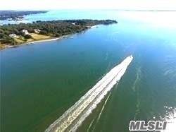 Paradise found. Spectacular shy acre of waterfront property on quiet dead end street.