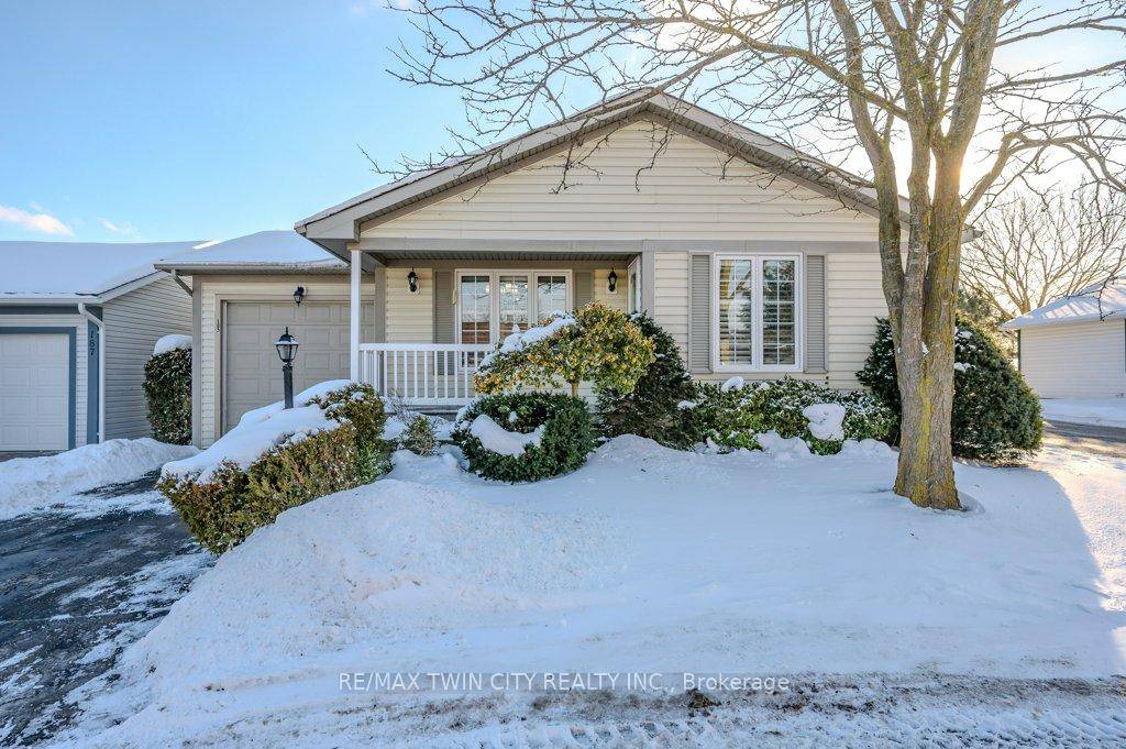 Charming BUNGALOW with attached tandem garage in sought after adult lifestyle community of Martin Grove Village.