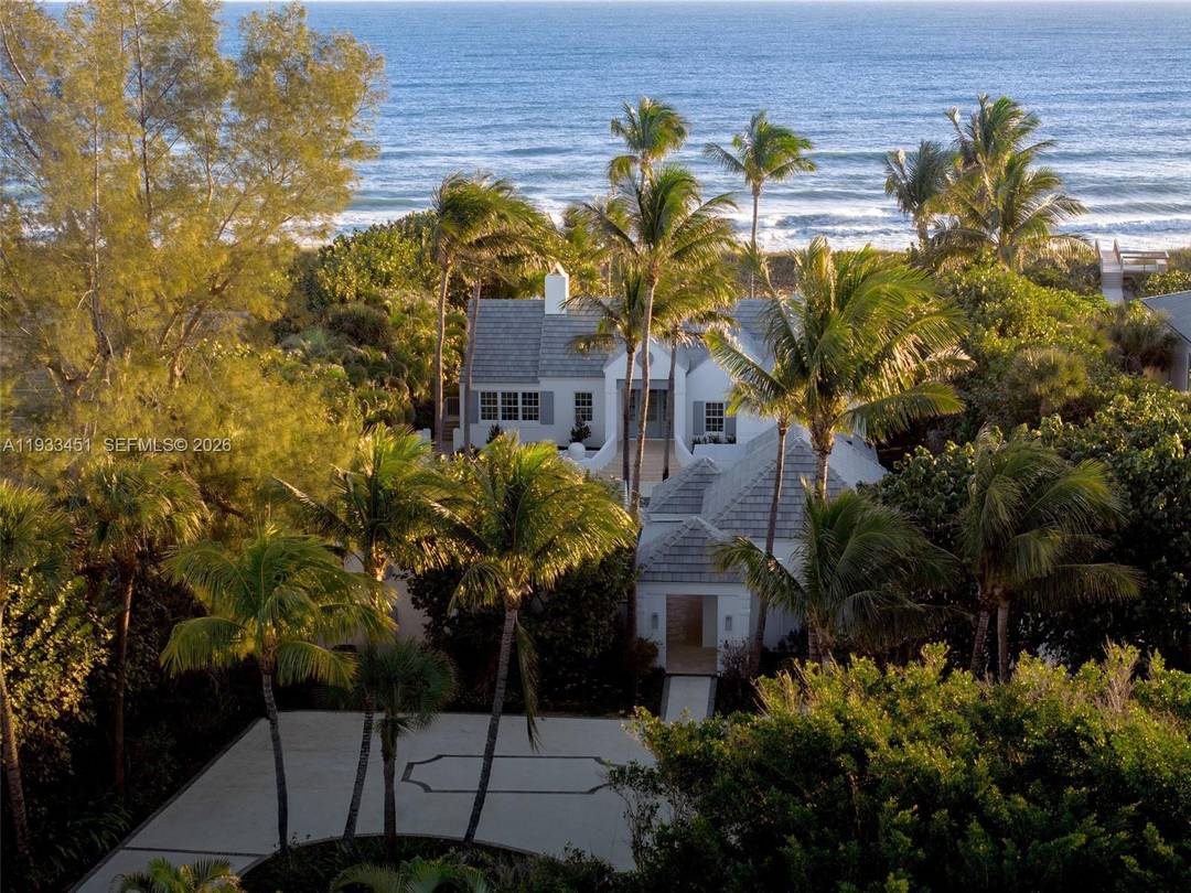 A truly distinctive completely renovated oceanfront estate on Jupiter Island, set on nearly 1 acre with a private compound layout Main Residence Guest House Cabana.