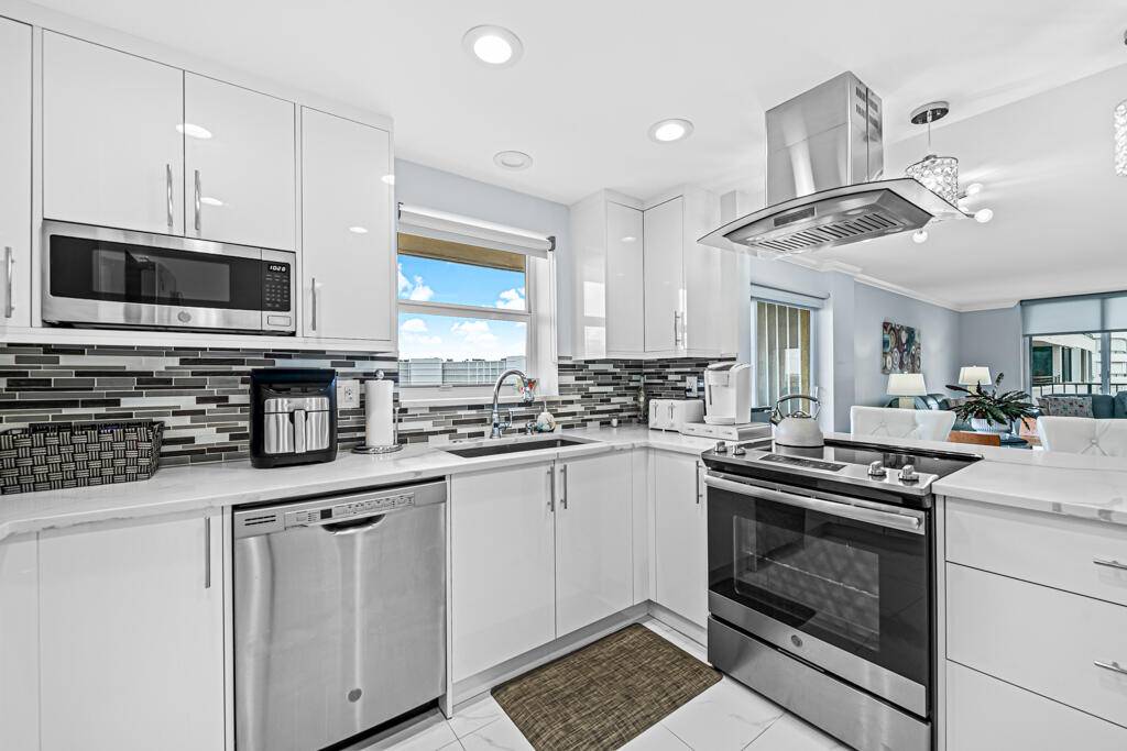Condo totally renovated, impact windows as well as hurricane shutters on exterior of its 2 balconies to enclose for patio furniture, etc.