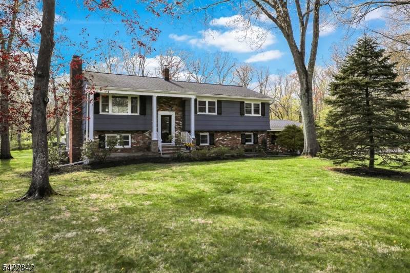 Situated at the end of a tranquil cul de sac in Basking Ridge, this sun filled 4BR 4BA home sits on a park like.