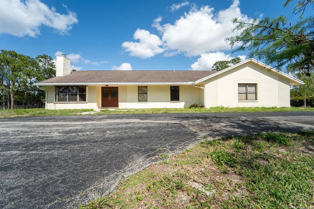 Located within the gated Homeland community, this beautiful single family home offers a comfortable blend of style and everyday living on nearly five private acres.