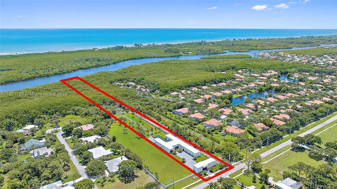 Built in 2022 on over 4 acres, this exceptional property is a dream for car collectors and boaters alike, offering 8 garages with room for lifts and direct Intracoastal access.