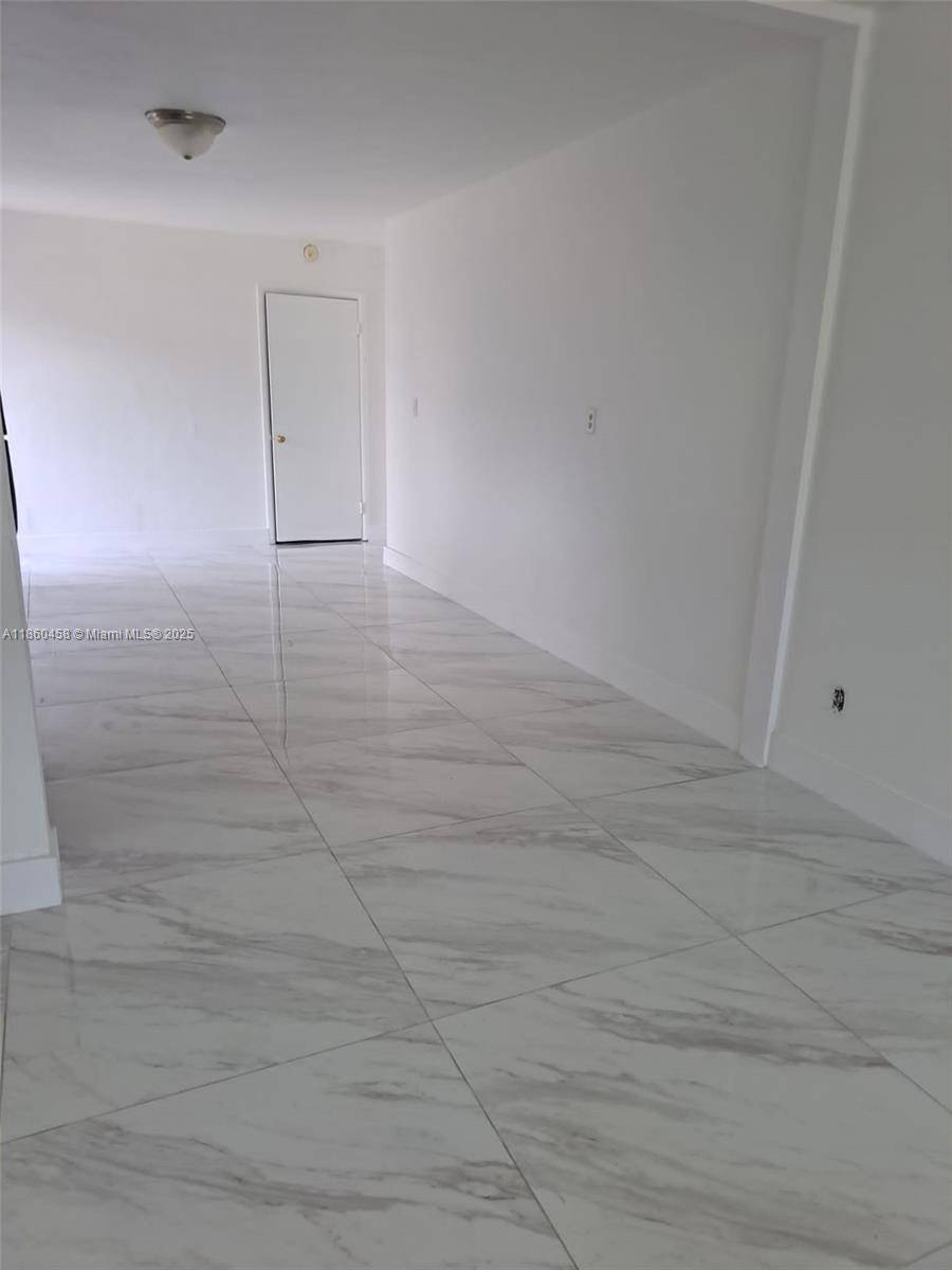 Well Maintained Triplex Income Potential Renovated Unit Extra Large Lot !