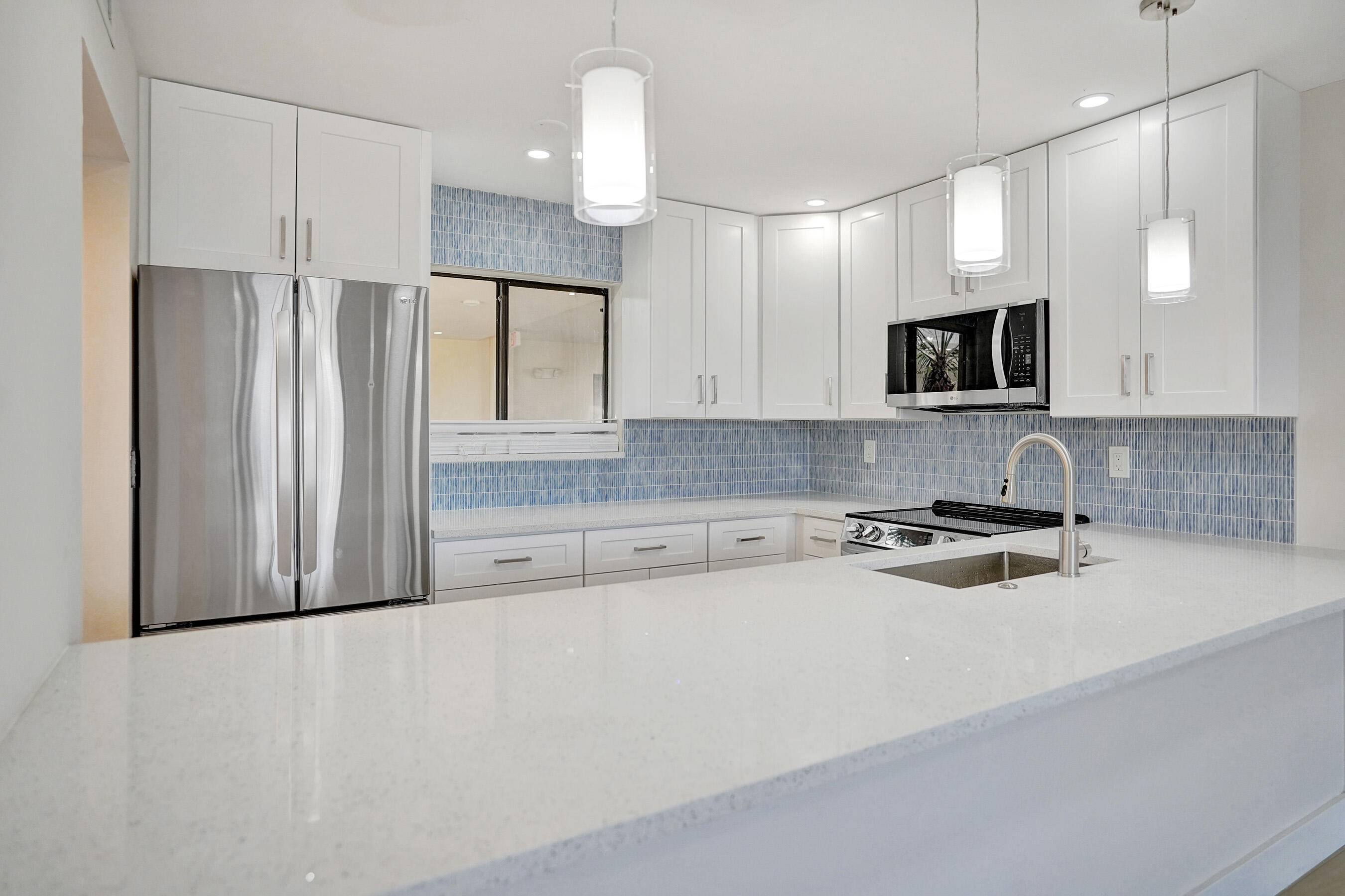 DELRAY BEACH GEM ! Exquisite top floor condo, where modern sophistication meets attention to detail.