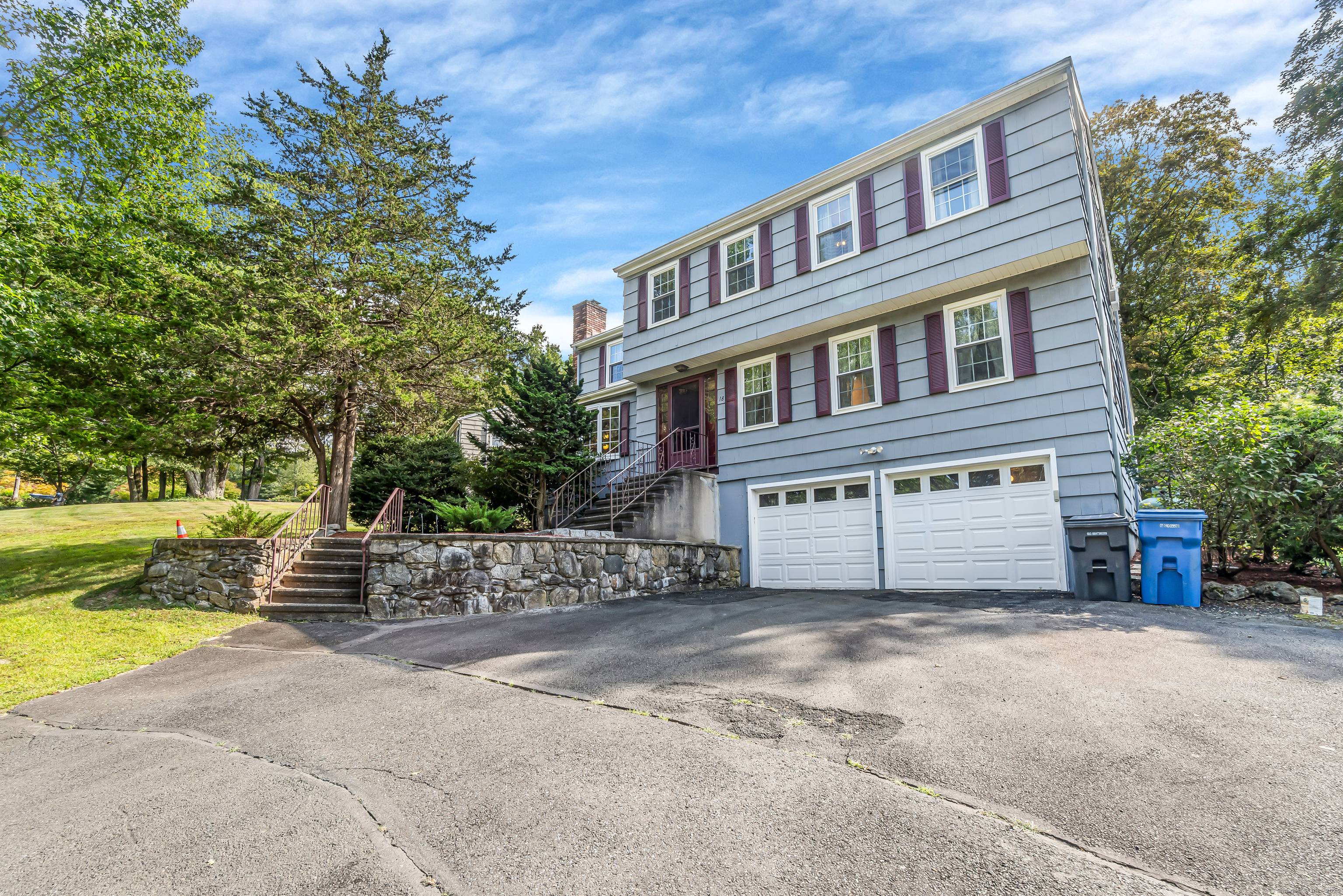 A timeless Colonial that boastfully sits on a perfectly blended grassy and wooded acre lot.