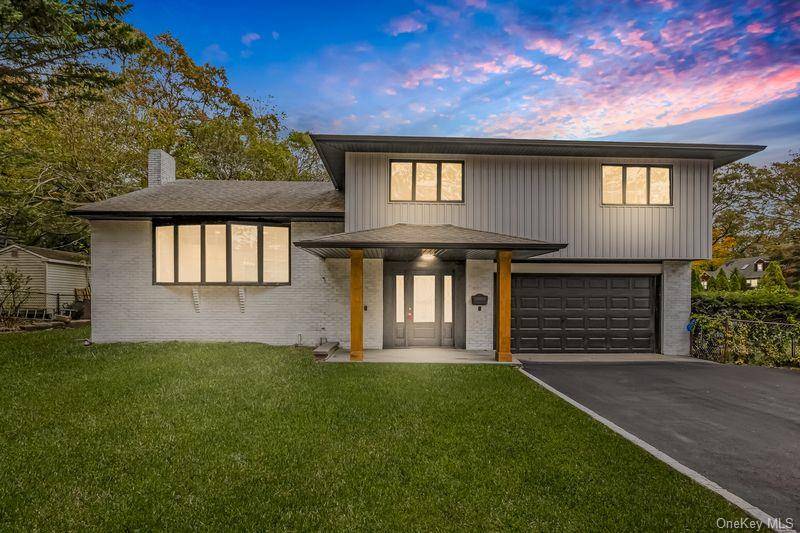 Welcome to this beautifully renovated split level home offering stunning lake views !