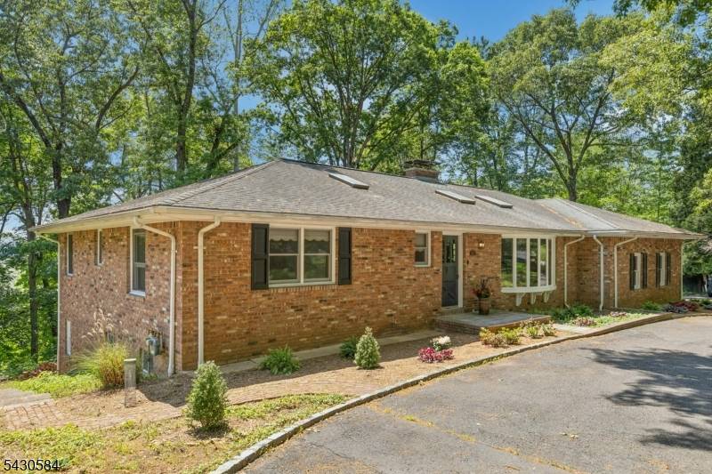 Perched to capture beautiful seasonal views, this well maintained ranch offers timeless character, quality construction, and exceptional potential.