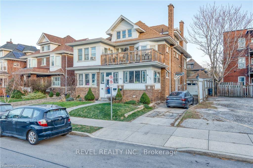 LEGAL non conforming triplex situated on a quiet boulevard in the Hamilton downtown core.