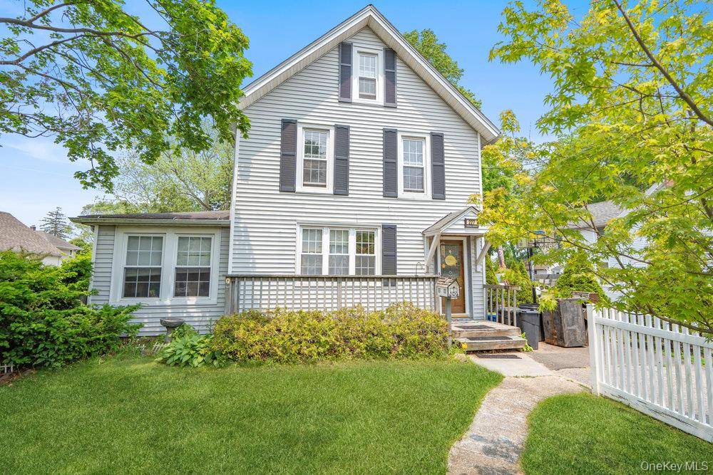 Charming Victorian era home built in 1884 is perfectly positioned on a beautiful tree lined street.