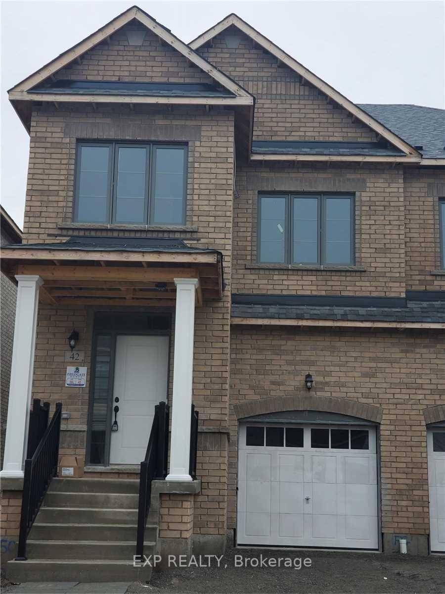 Stunning East facing bright spacious semi detached with a modern open concept kitchen with stainless steel appliances, functional pantry amp ; dining room with custom cabinetry, fireplace in living room.
