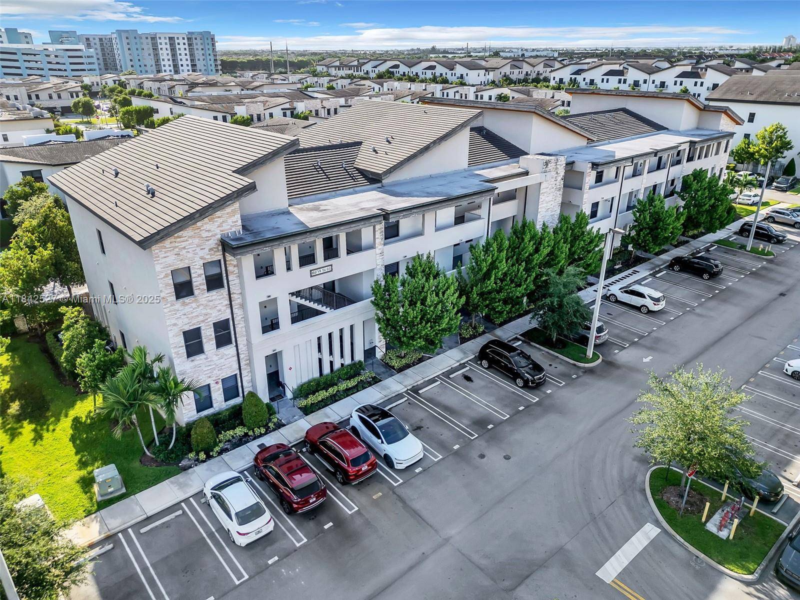 Motivated Seller Easy to Show Modern 2BR DEN 2BA condo in APEX at Park Central, a gated community in Doral.