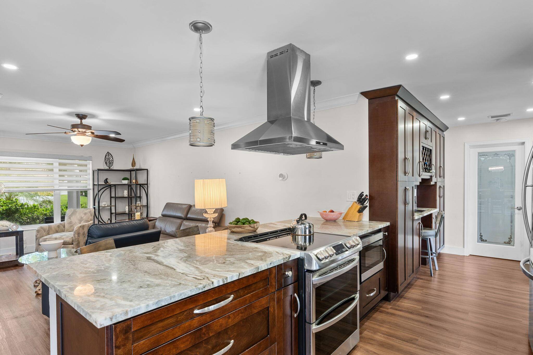 Welcome to this beautifully updated corner lot home with a pool in the highly desirable Boca Madera community, located along the prestigious St.