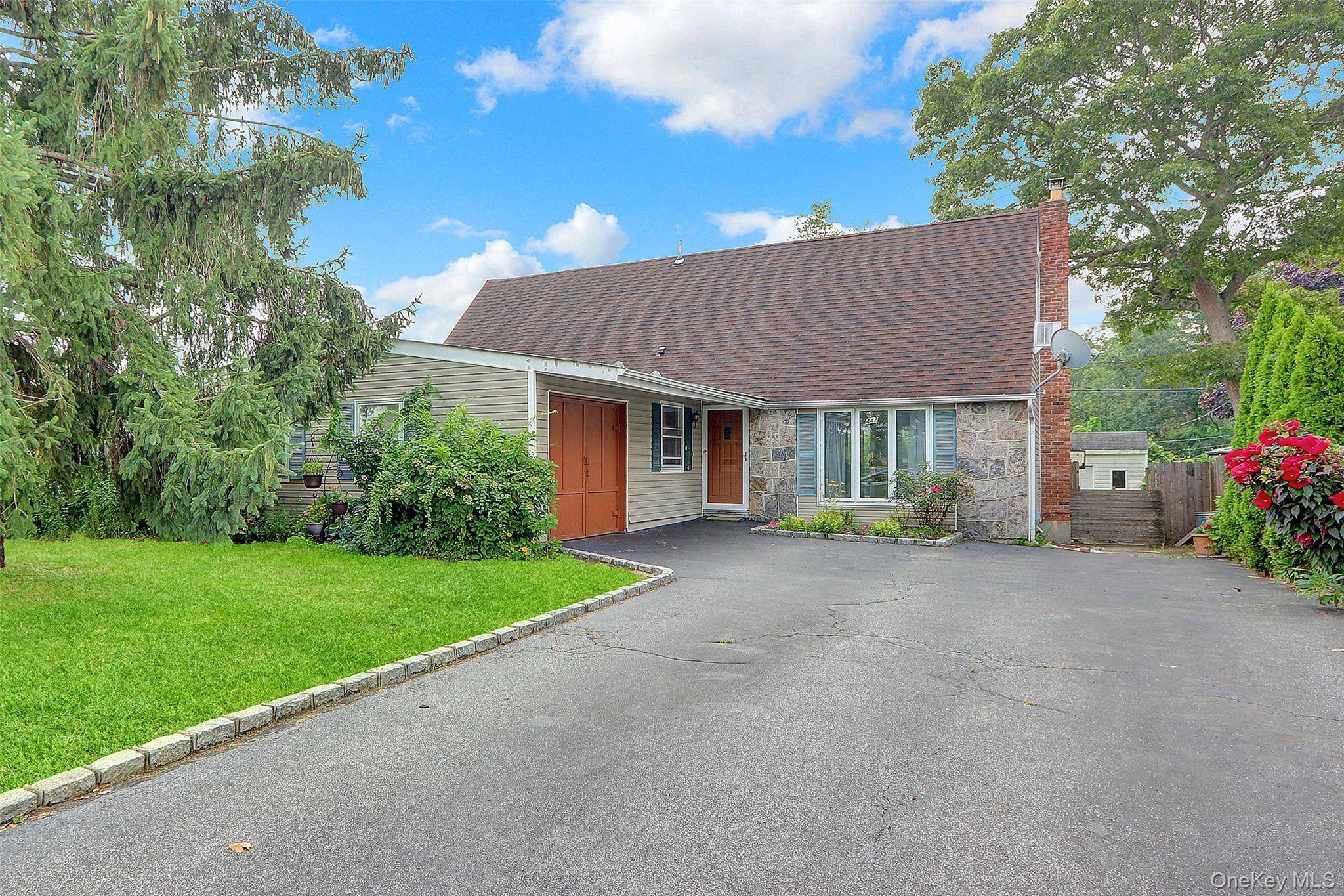 Welcome to 442 Hawkins Rd, Selden, NY a deceptively spacious expanded cape offering 4 bedrooms, 2.