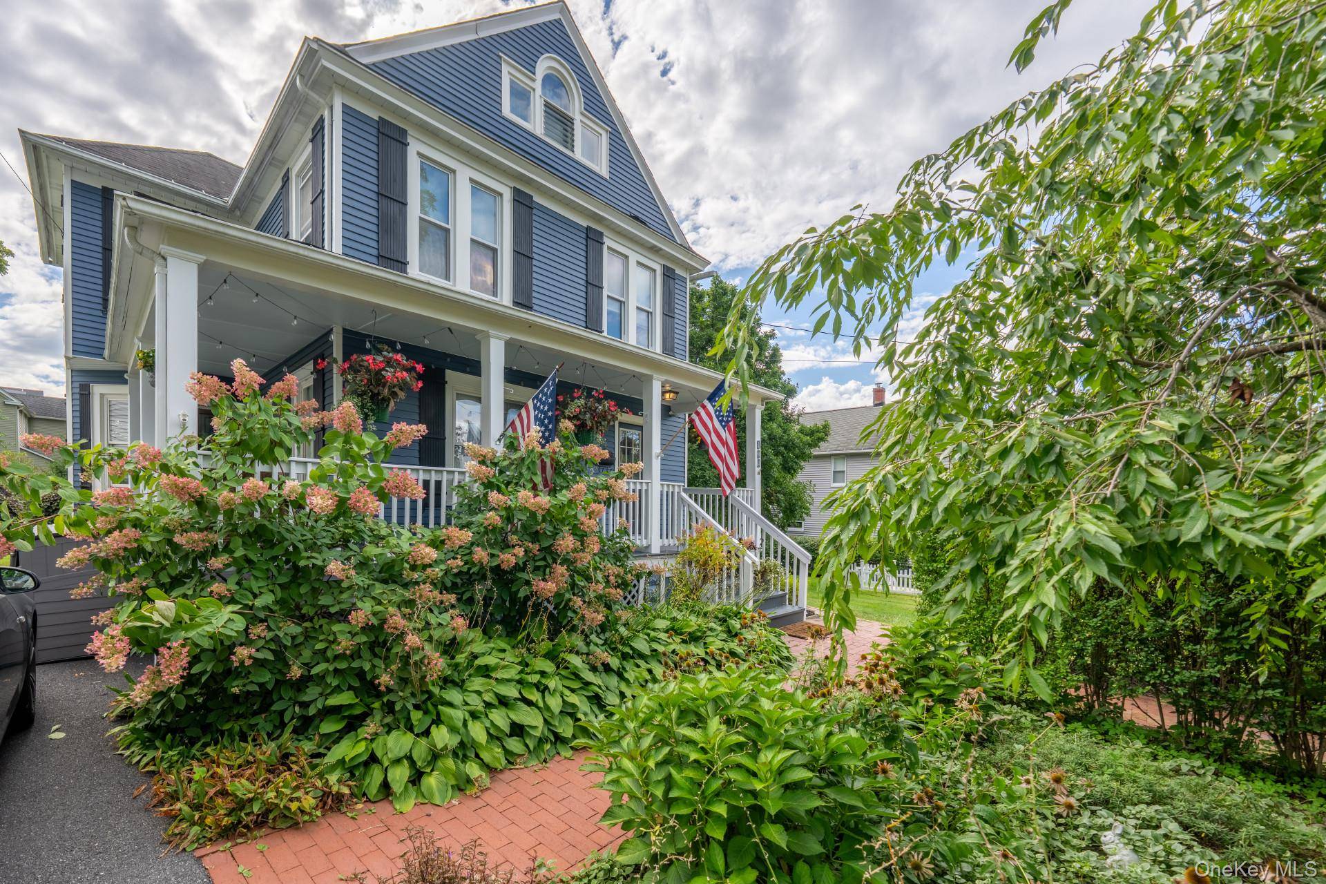 This lovingly restored 1901 Victorian home exudes warmth and comfort and you'll look forward to coming home every day.