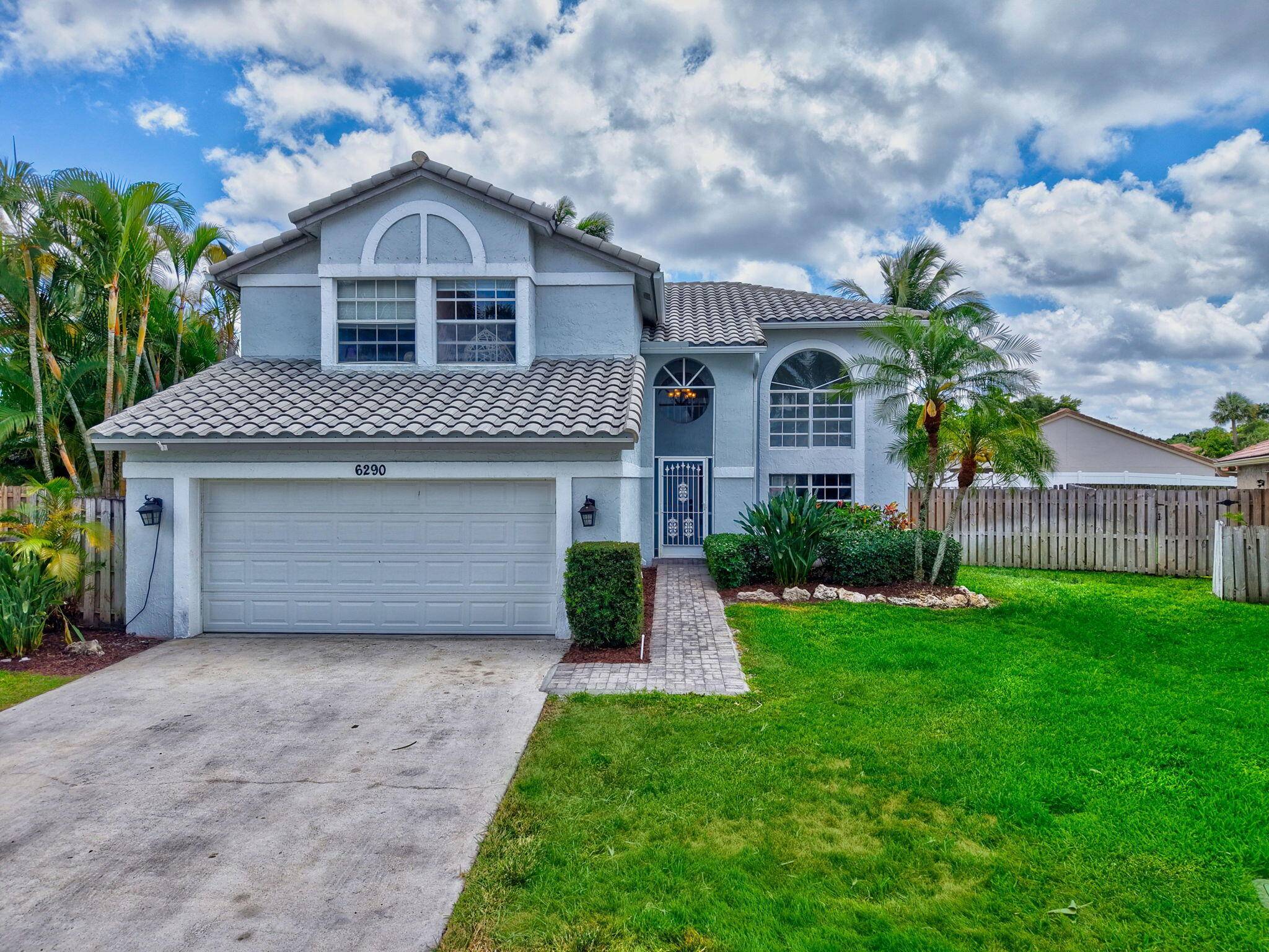 Welcome to this beautifully updated single family home in a friendly, guard gated neighborhood !