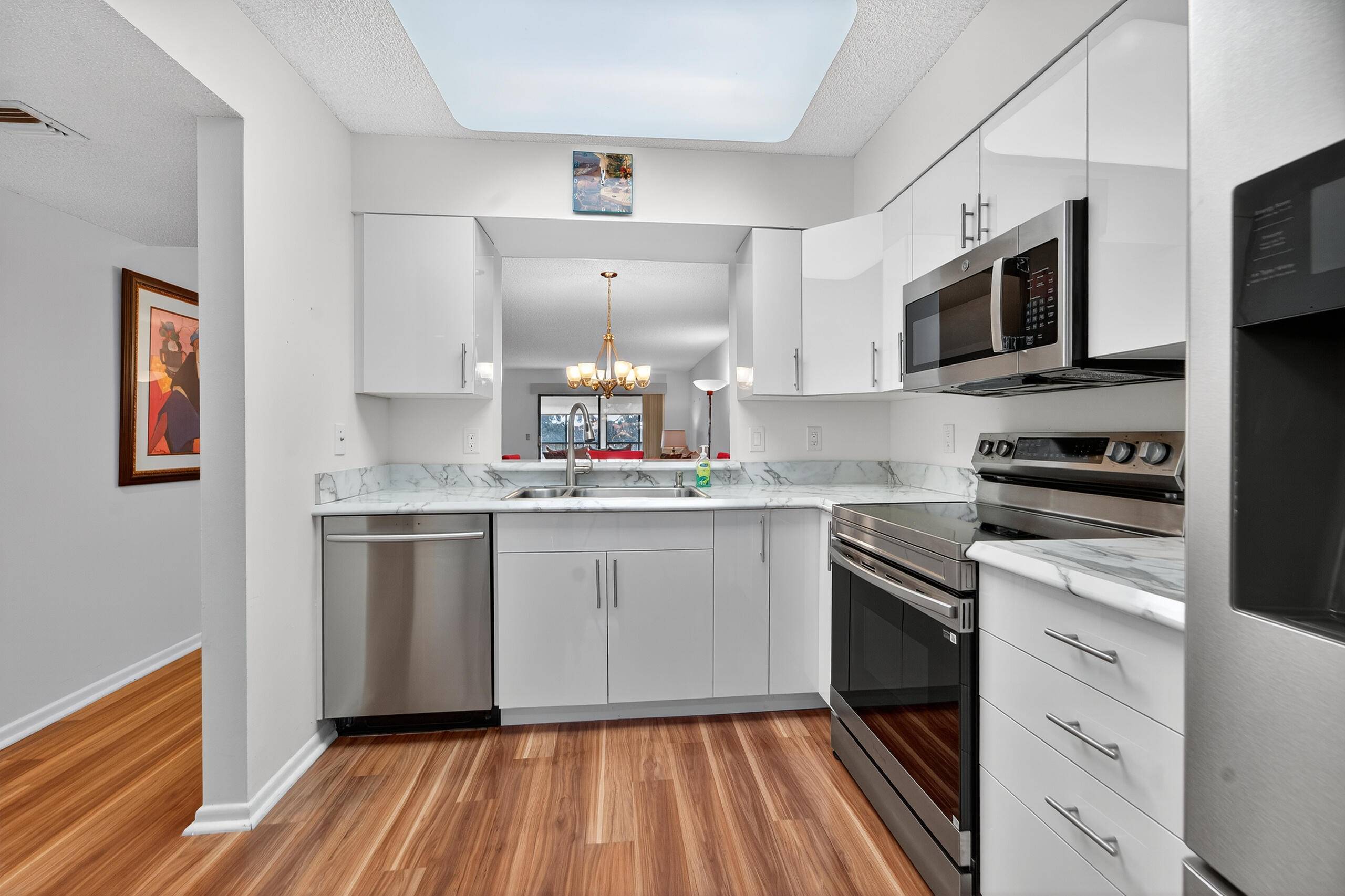 Immaculate, light, bright 2 2 penthouse condo with den and Florida room with panoramic lake view.
