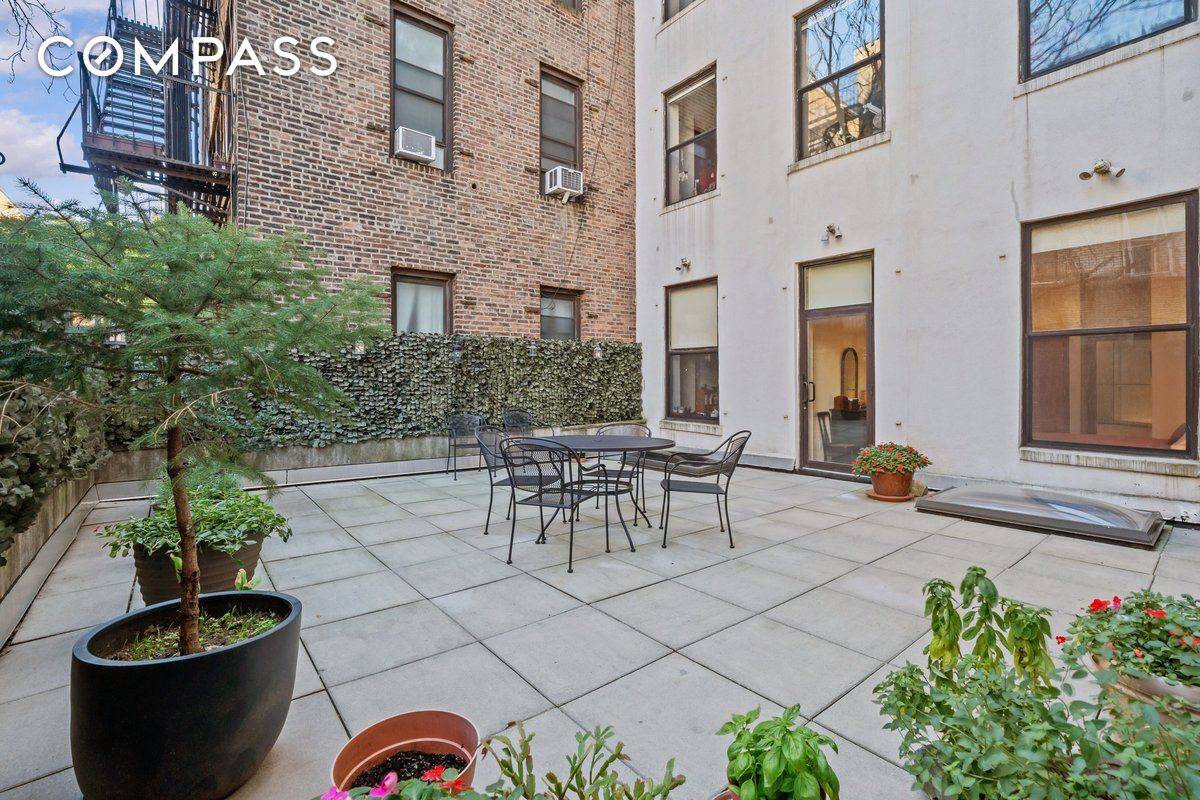 A sprawling private terrace, enveloped in serenity and seclusion, sets the stage for this extraordinary residence on the third floor of 133 West 14th Street.
