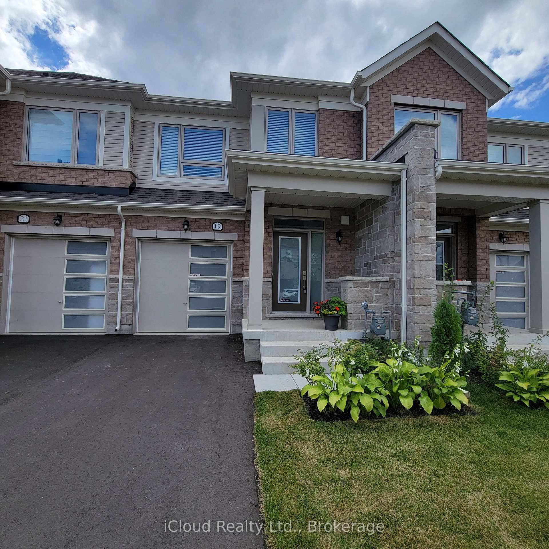 Welcome to this Modern Brick and Stone Elevation B Premium townhouse in Fergus's new Storybrook subdivision.