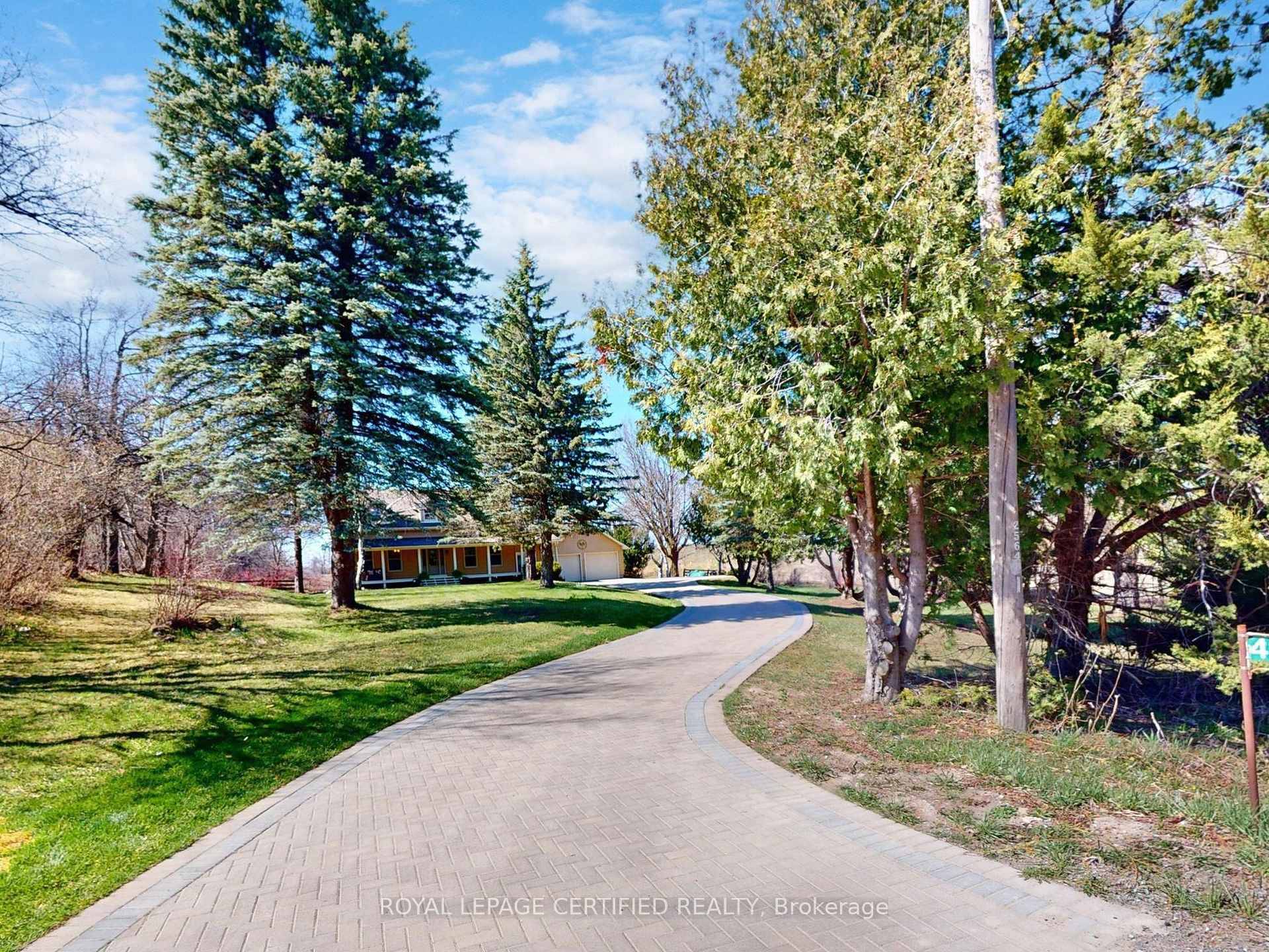 Privately situated in middle of trees and on a side street,