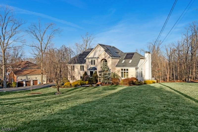Set atop the highly sought after Martinsville mountaintop section, this exceptional custom built brick home offers privacy, elegance, and breathtaking views on 1.