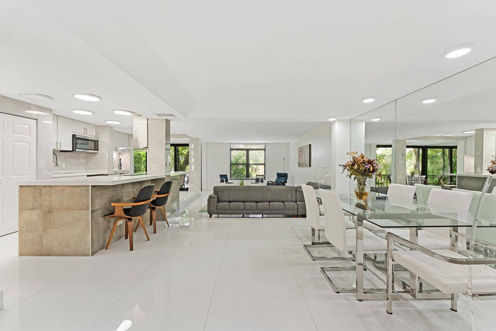 Beautifully reimagined corner unit in a prestigious waterfront community, offering sweeping water views and exquisite designer finishes throughout.