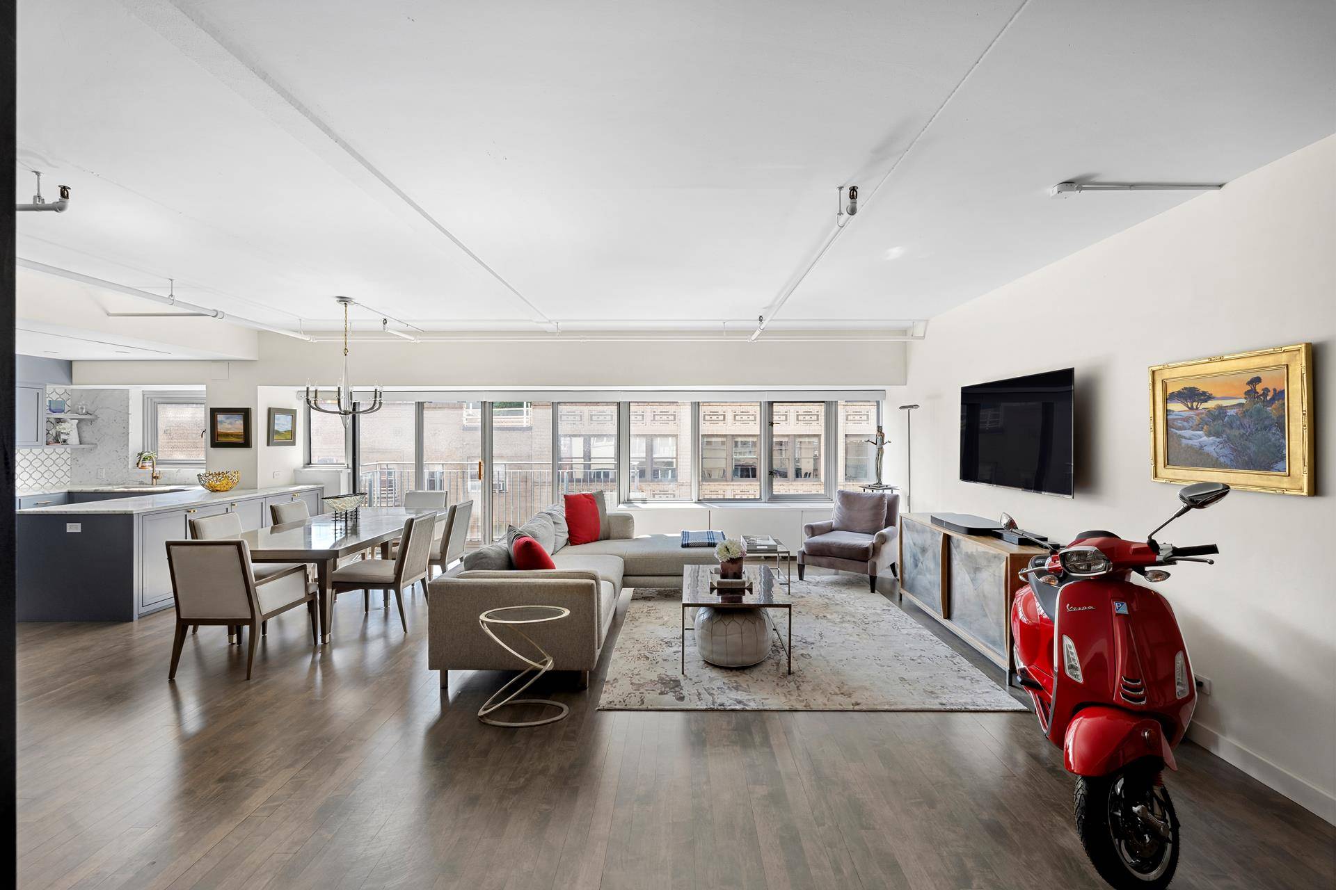 Located in the heart of Chelsea is a sprawling, south facing 2000 SF convertible 3 bedroom, 2 bathroom condominium with a wall of 20 windows !