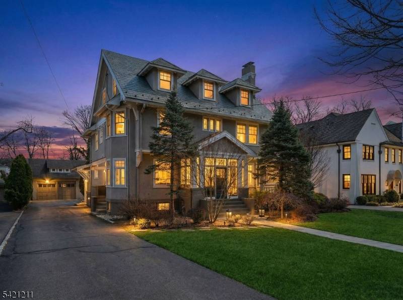 Ideally located just a block from Maplewood Village, this beautifully updated 1910 Colonial set on an expansive, professionally landscaped property that seamlessly blends timeless character with modern upgrades.