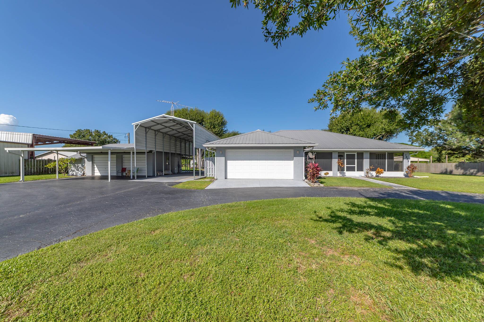 Ousley Estates Beautifully maintained CBS 3 bedroom, 2 bath home with a screened, heated pool on just over an acre in the desirable southwest area.