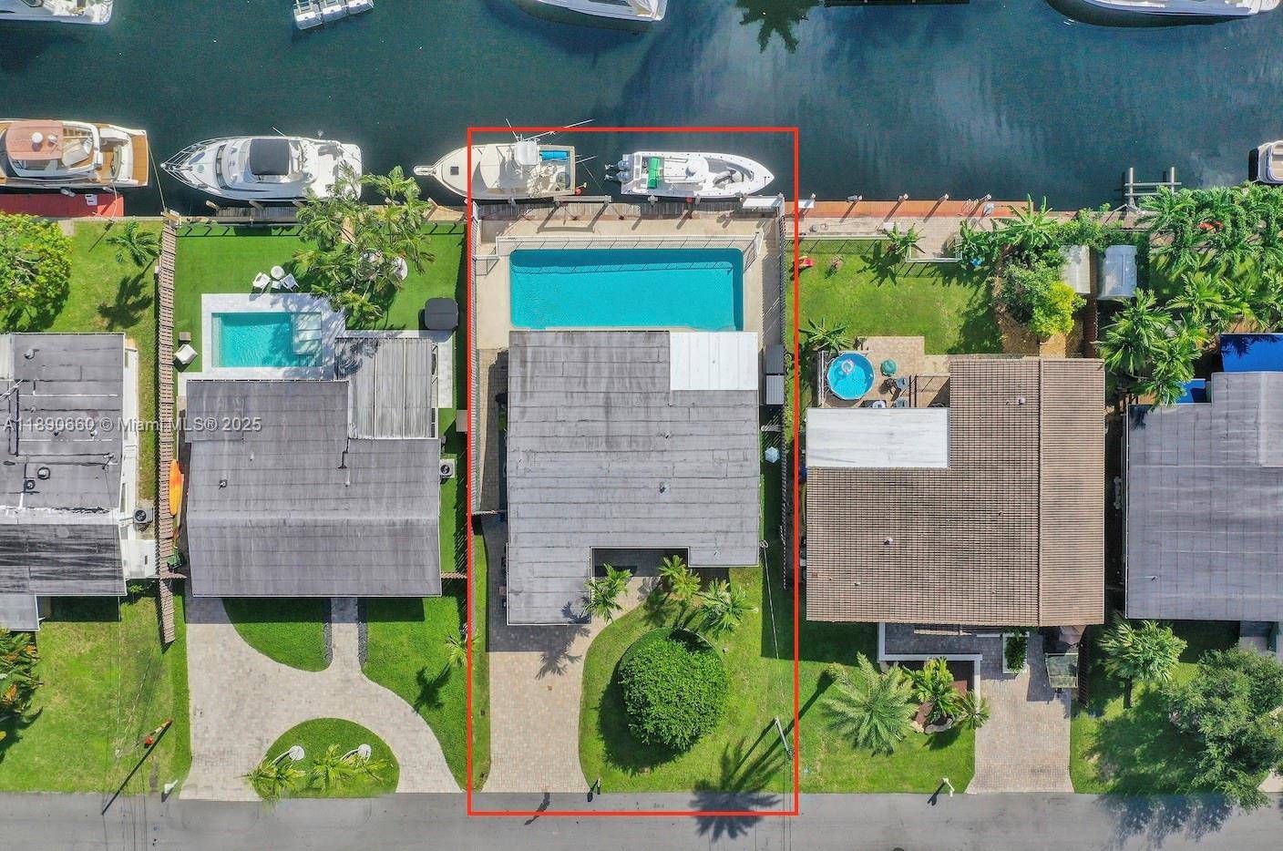 Beautiful South Florida home with 65 FEET OF WATERFRONT WITH NO FIXED BRIDGES offering easy access for boats of all sizes.
