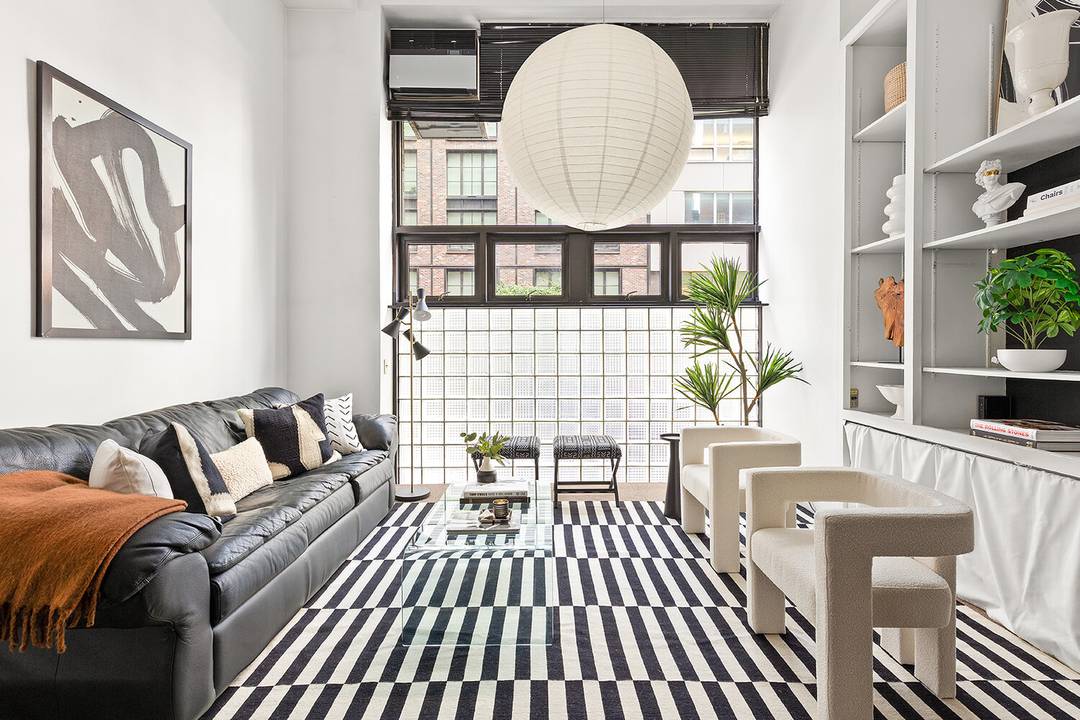 Residence 1B is a true New York loft offering over 1, 100 square feet across two levels.