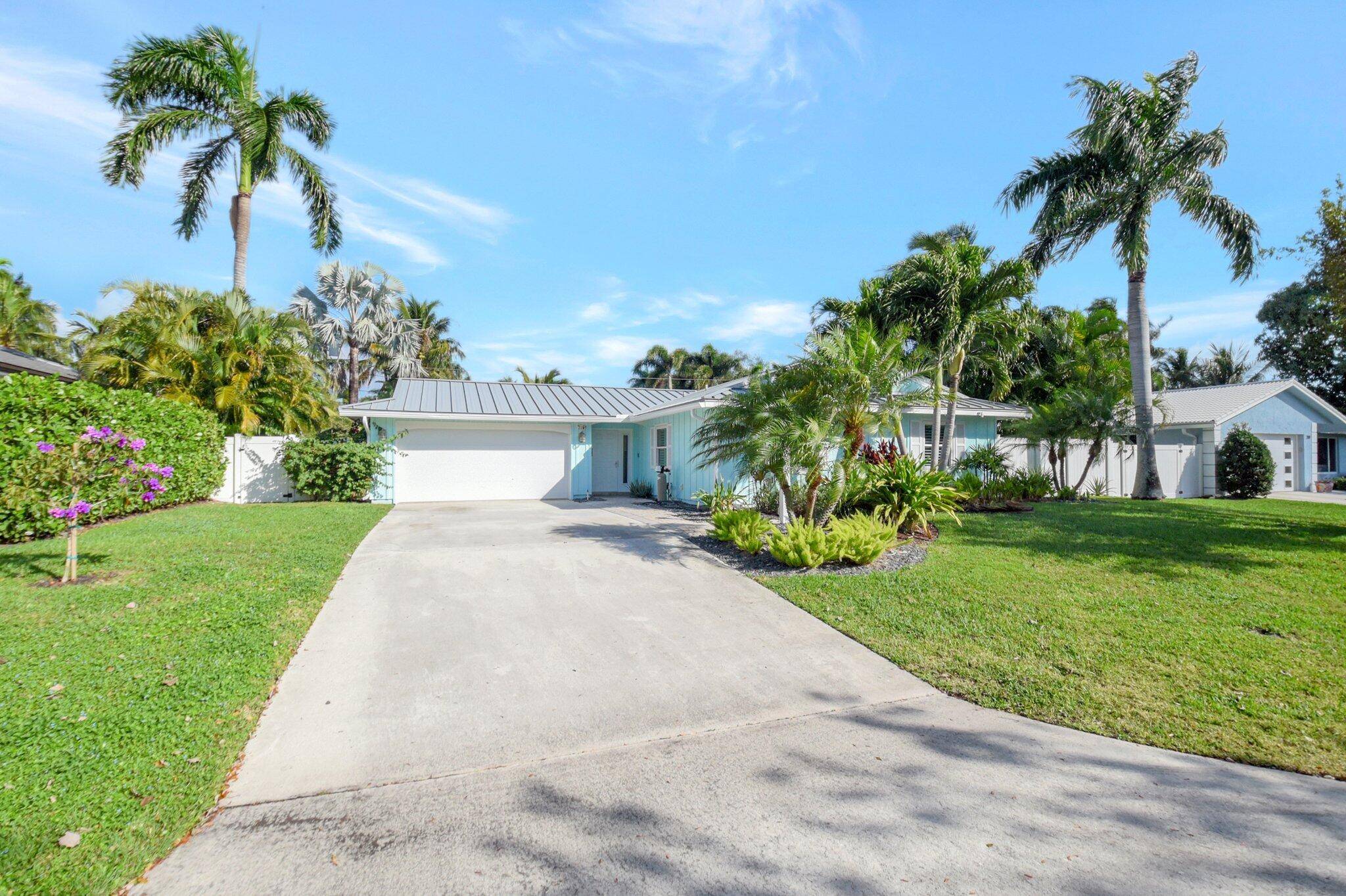 This charming Key West style home in Lake Ida offers 3 bedrooms, 2 baths, and an open concept design.