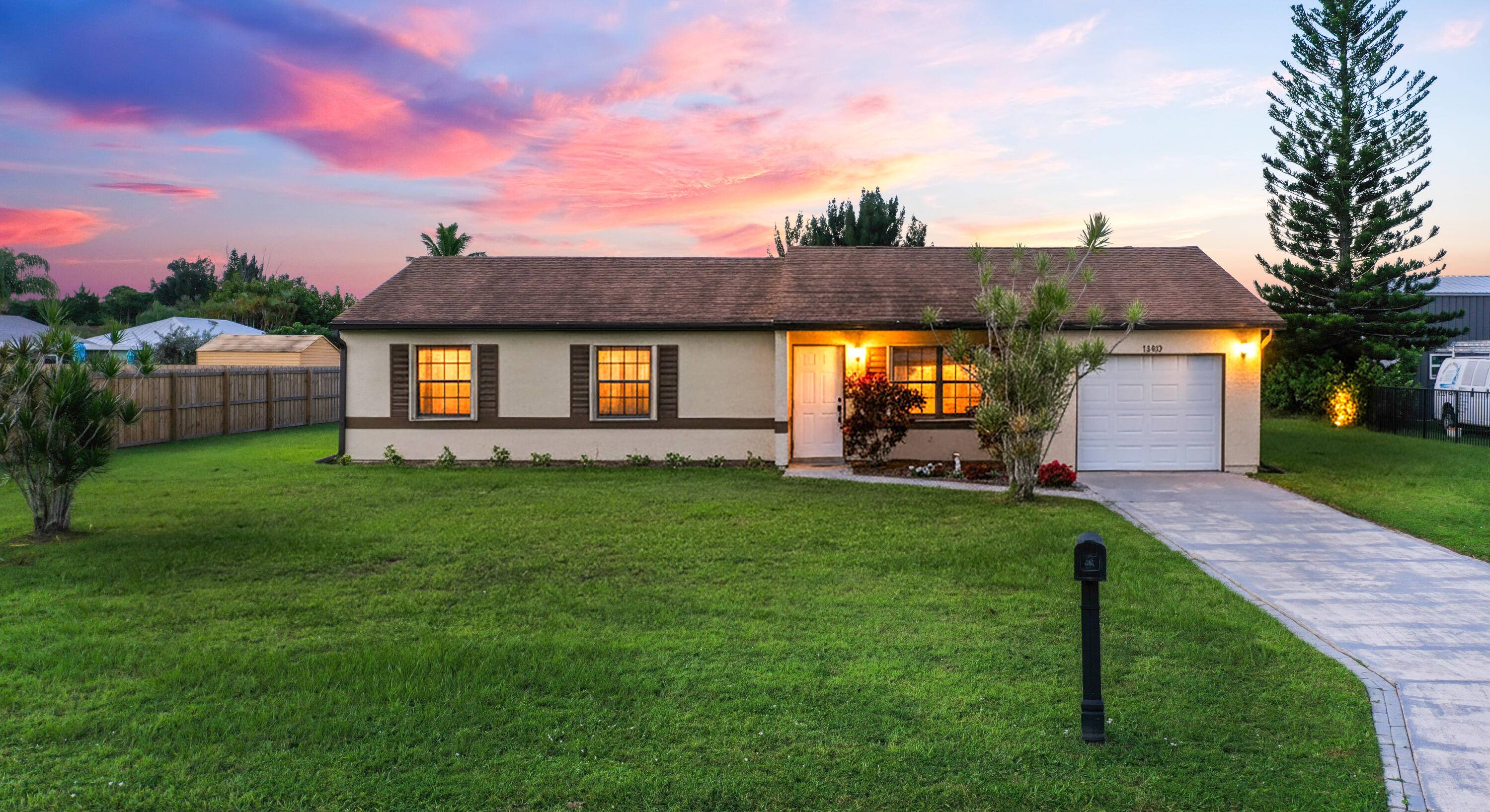 Charming 3 bedroom, 2 bath home featuring tile floors throughout, vaulted ceilings, granite countertops, and spacious rooms with a comfortable flow.