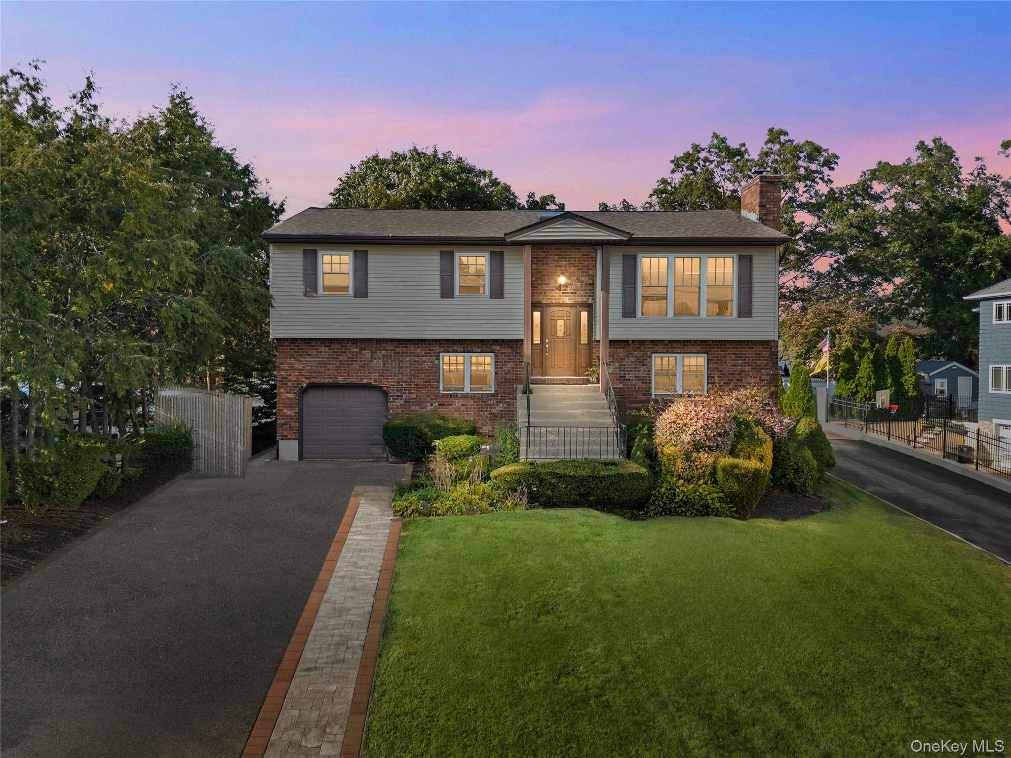 Introducing 42 Schoolhouse Road, a spacious 5 bedroom, 3 bath Hi Ranch nestled on a quiet block in Old Bethpage.