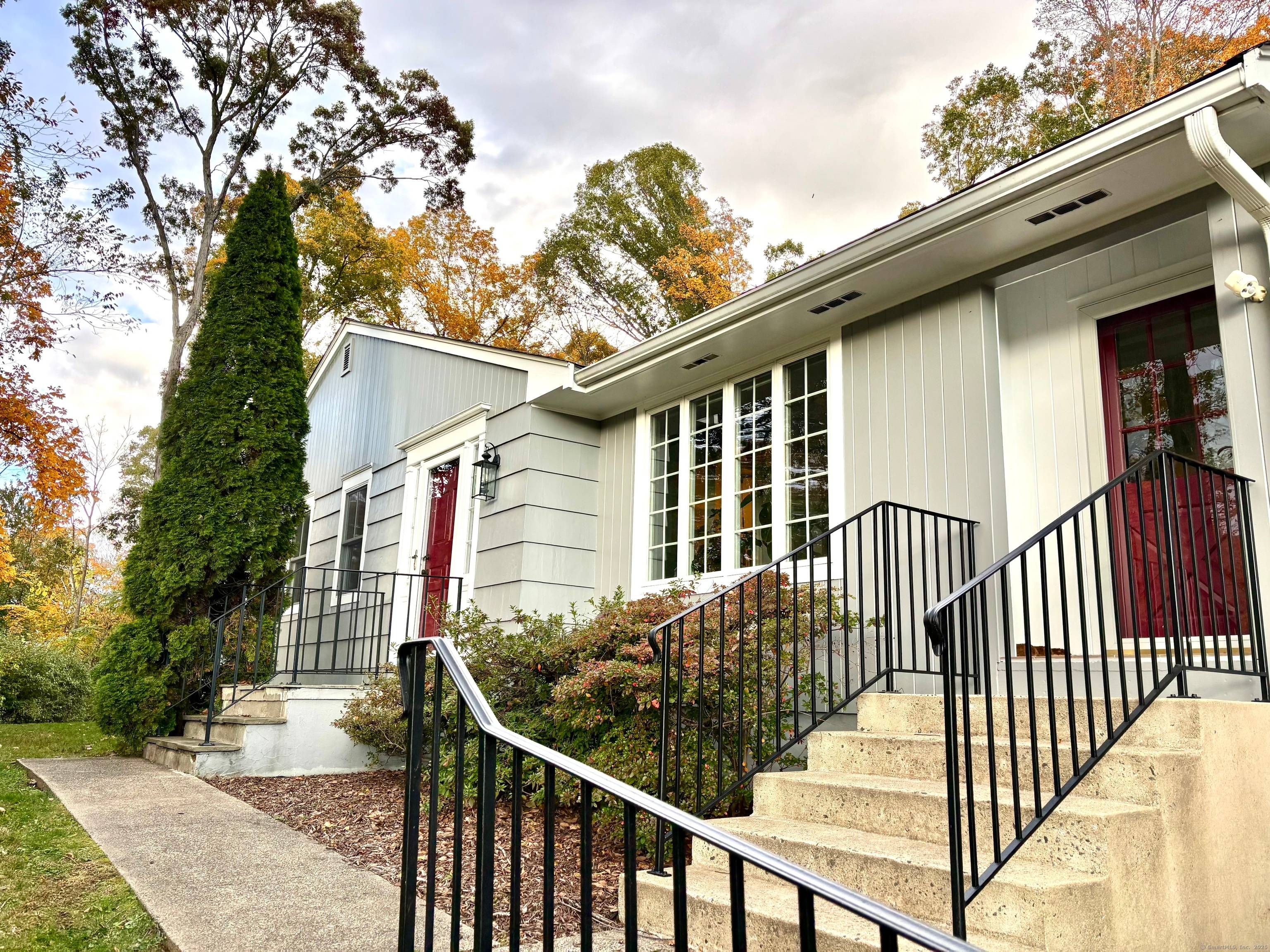 Nestled at the gateway to Pine Orchard, set back from the road, sits this sprawling ranch in a private, park like setting.