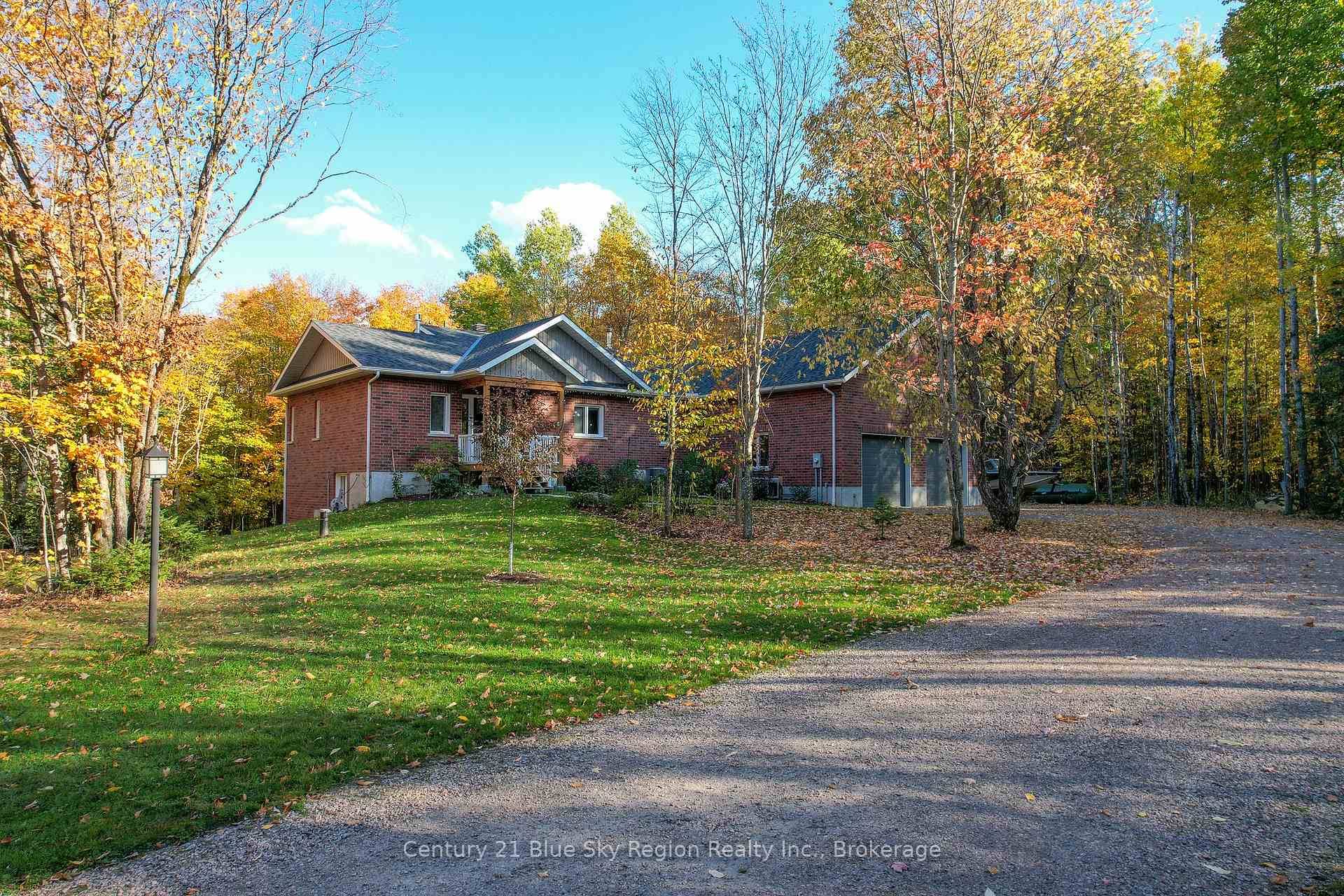 Privately set on nearly 10 acres and 400 feet from the road, this craftsman house was created with accessibility and light in mind.