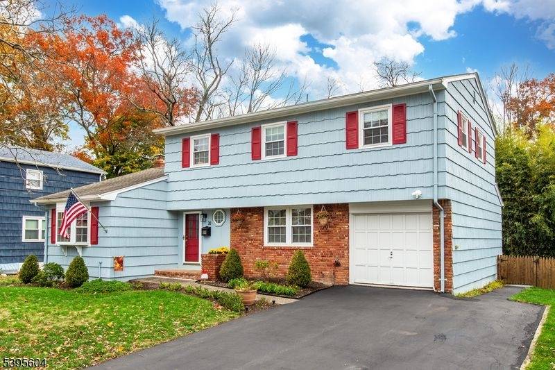 Welcome to this beautifully maintained Colonial home featuring 4 spacious bedrooms and 2.