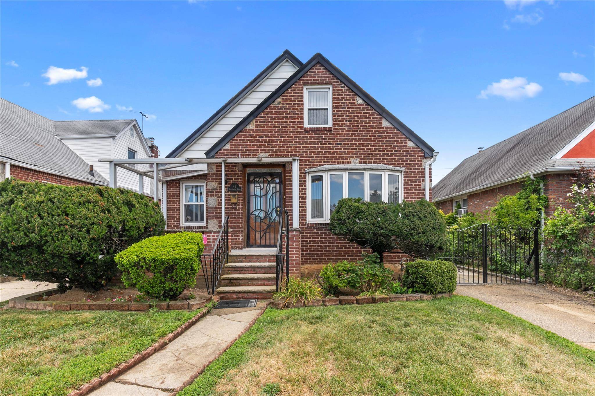 Welcome to 48 Wellington Road, Elmont a well maintained Cape Cod style single family home offering a versatile layout and functional living spaces.