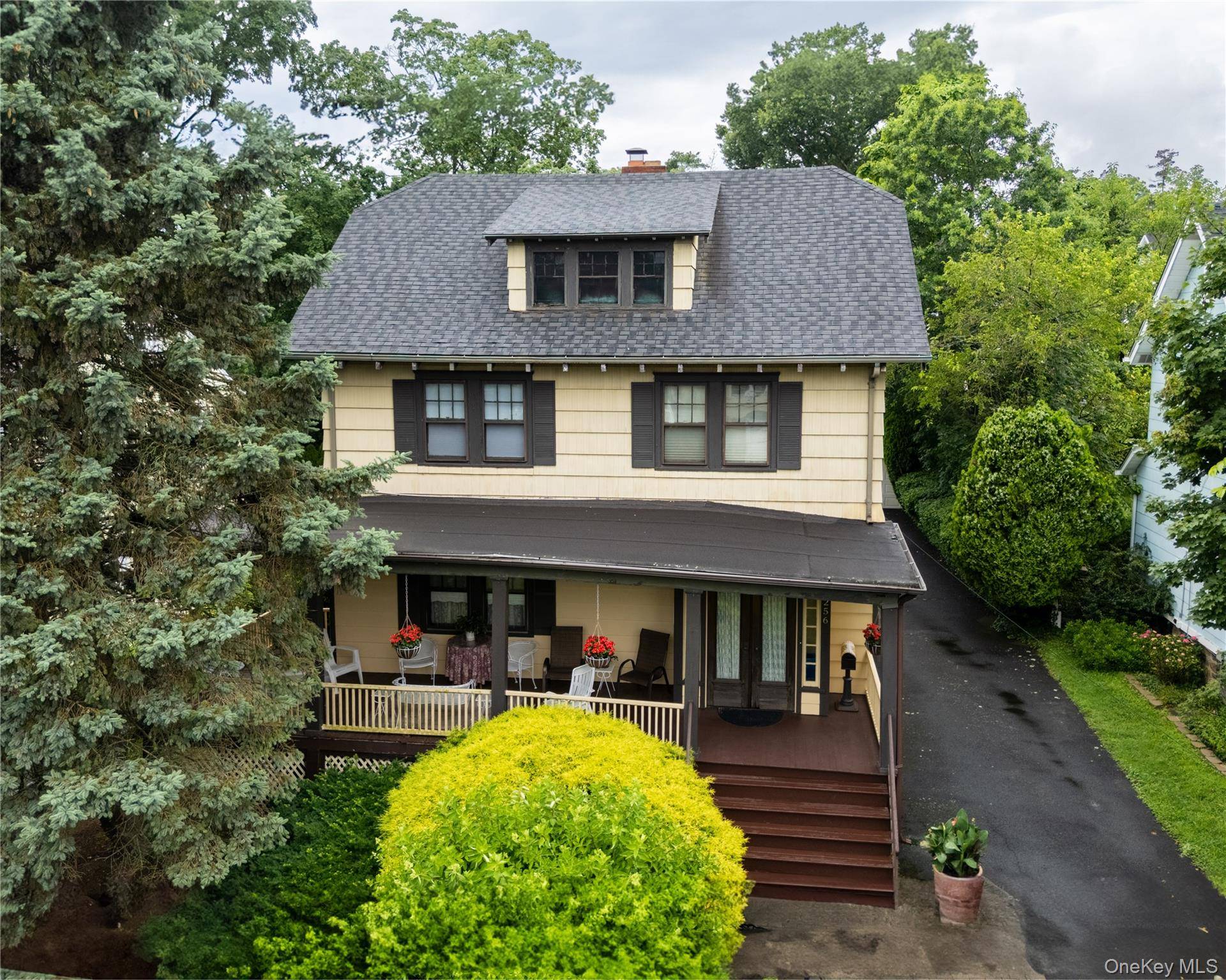 Colonial with open front porch for lazy afternoons and warm summer evenings.
