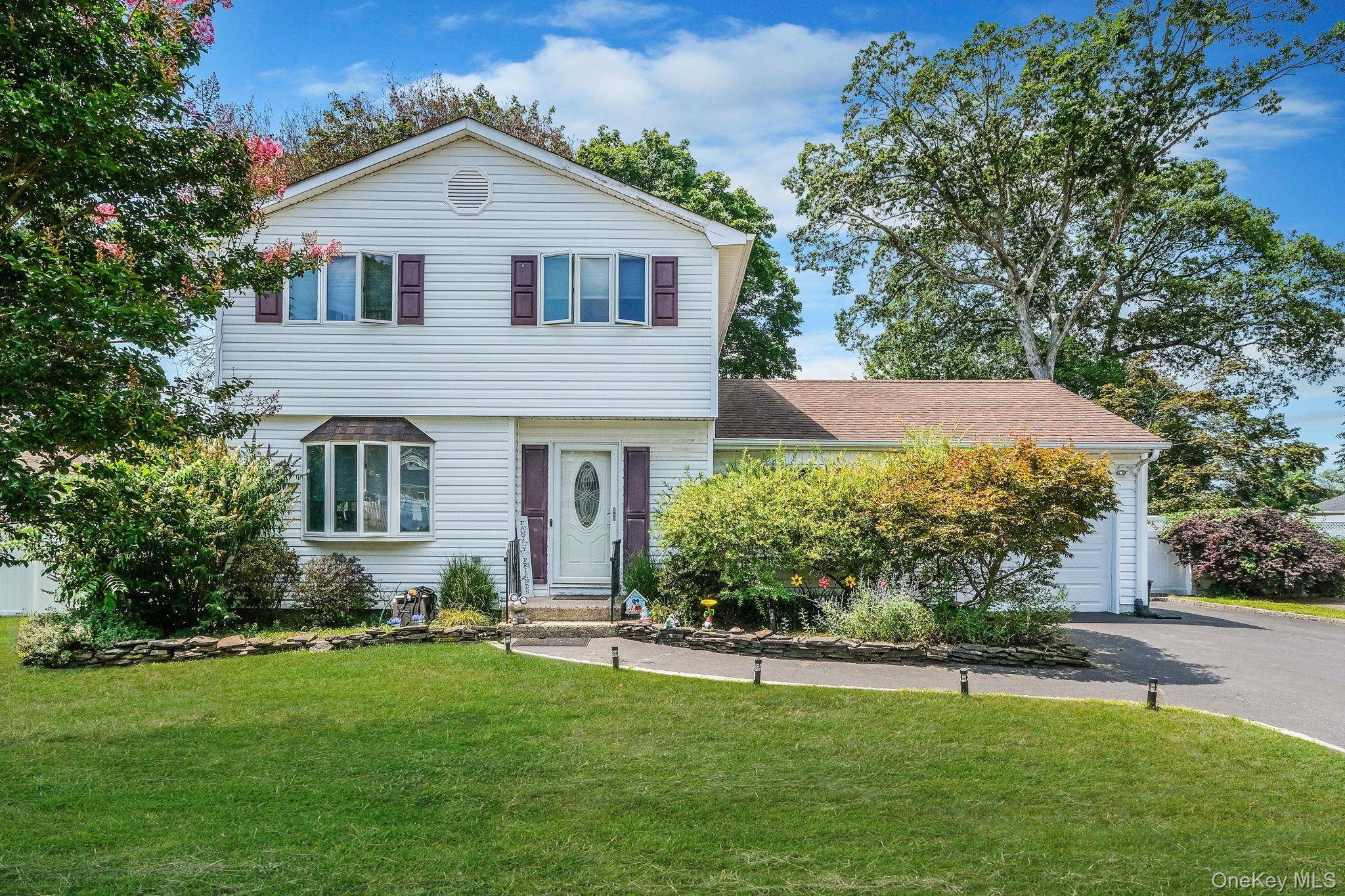 Welcome to this beautiful 4 bedroom, 2 bathroom home located in the heart of the Incorporated Village of Lake Grove in Middle Country School District.