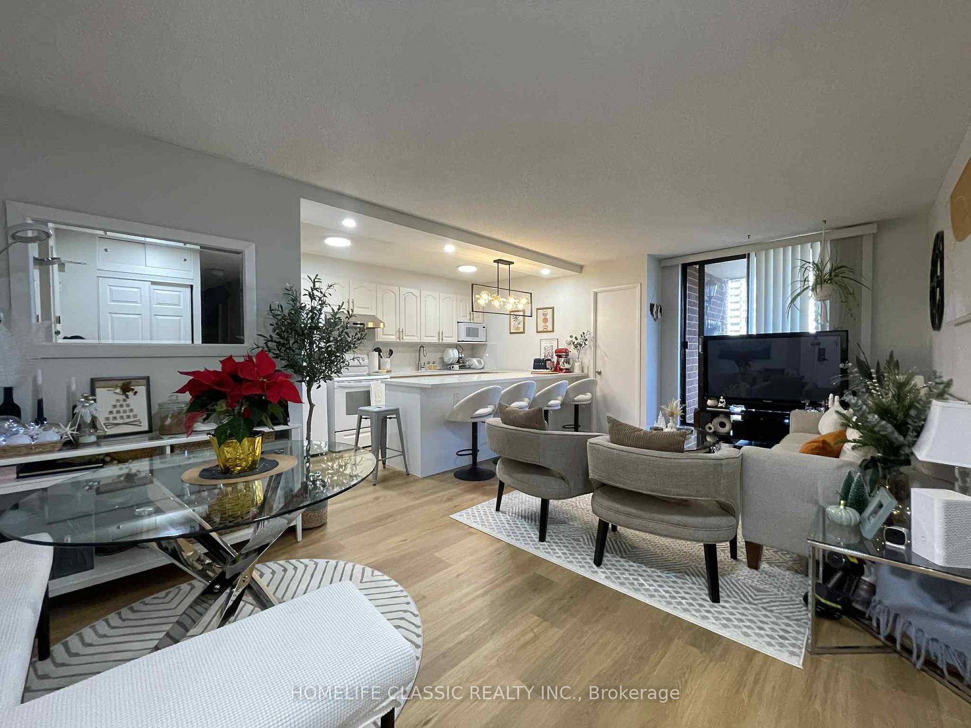 Stunning, well maintained end unit, 3 bedroom, 2 bathrooms, updated open concept kitchen with quartz countertop and backsplash combined with quartz countertop dining with new pendant light.