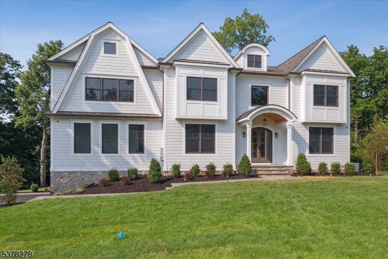 Welcome to 17 Hilltop Terrace, where impeccable design meets modern luxury in one of Chatham Township's most coveted locations.