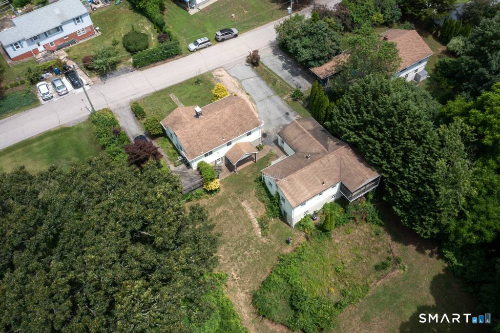 Rare income producing property featuring two separate ranch style homes on one lot, located approximately 1 4 mile from Mohegan Sun.