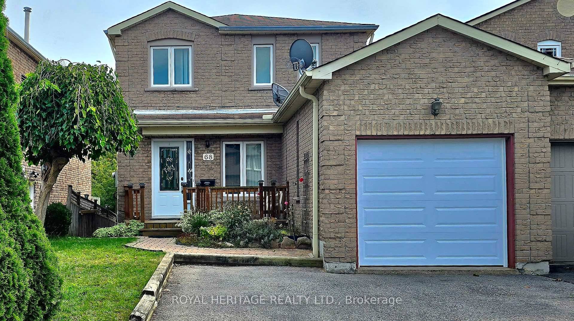 This all brick home has a walkout from the kitchen onto the composite deck leading down to the fenced yard abutting the treed ravine.